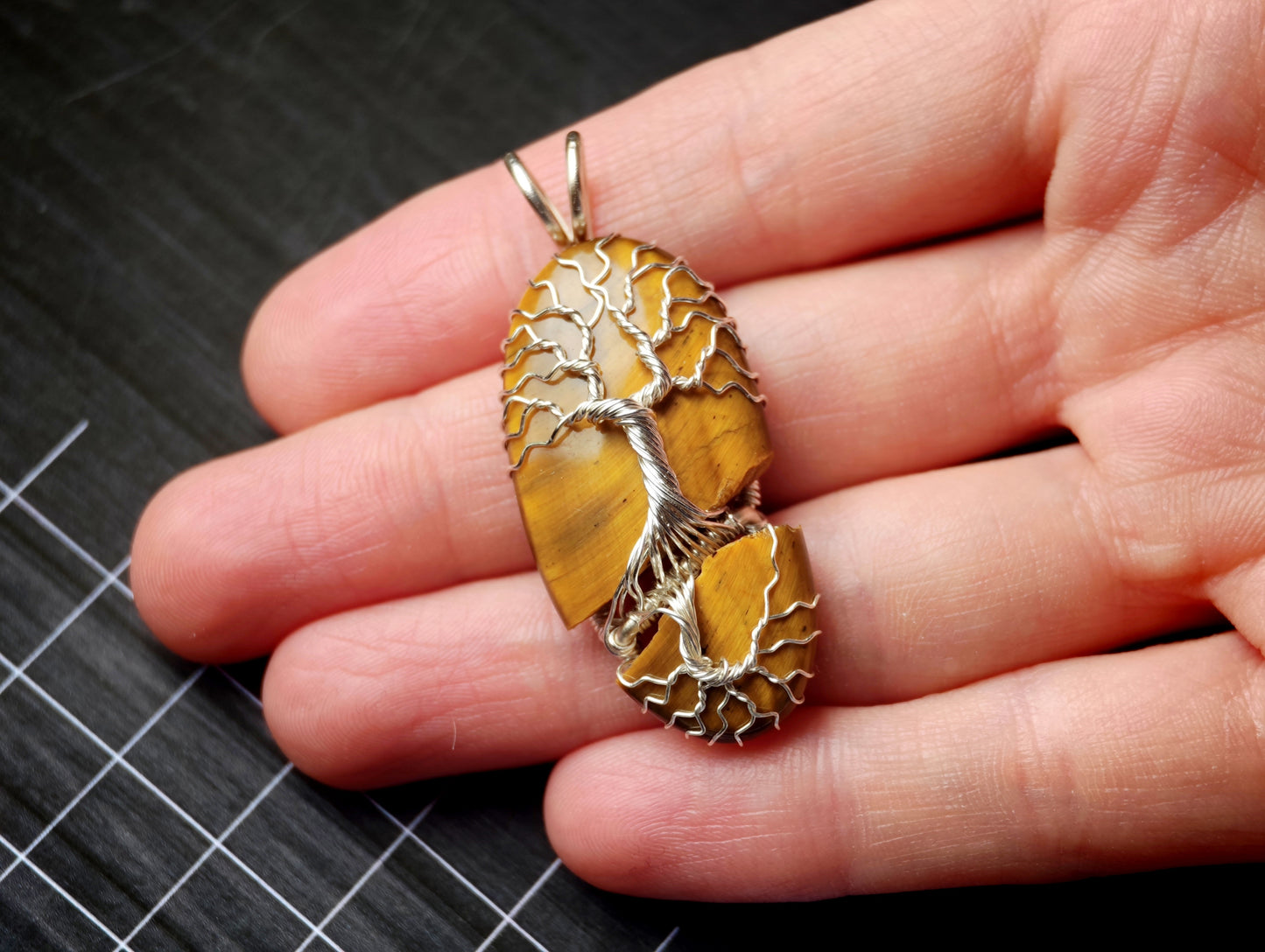 Tree pendant with a broken tiger's eye gemstone