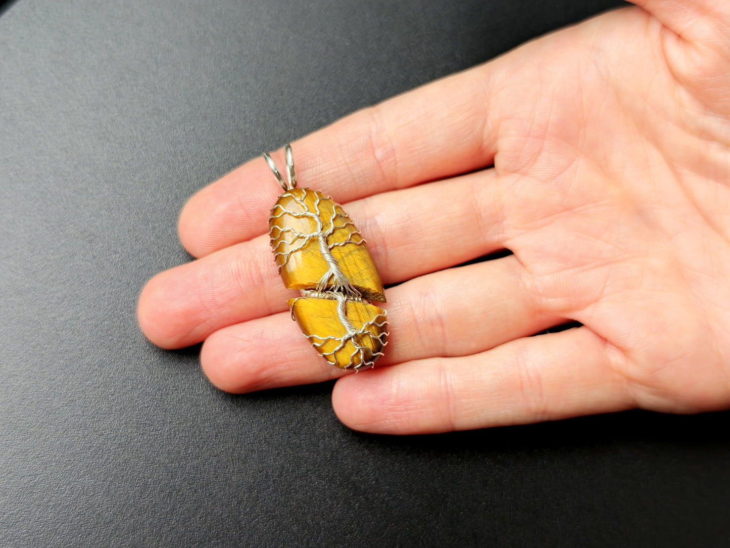 Tree pendant with a broken tiger's eye gemstone