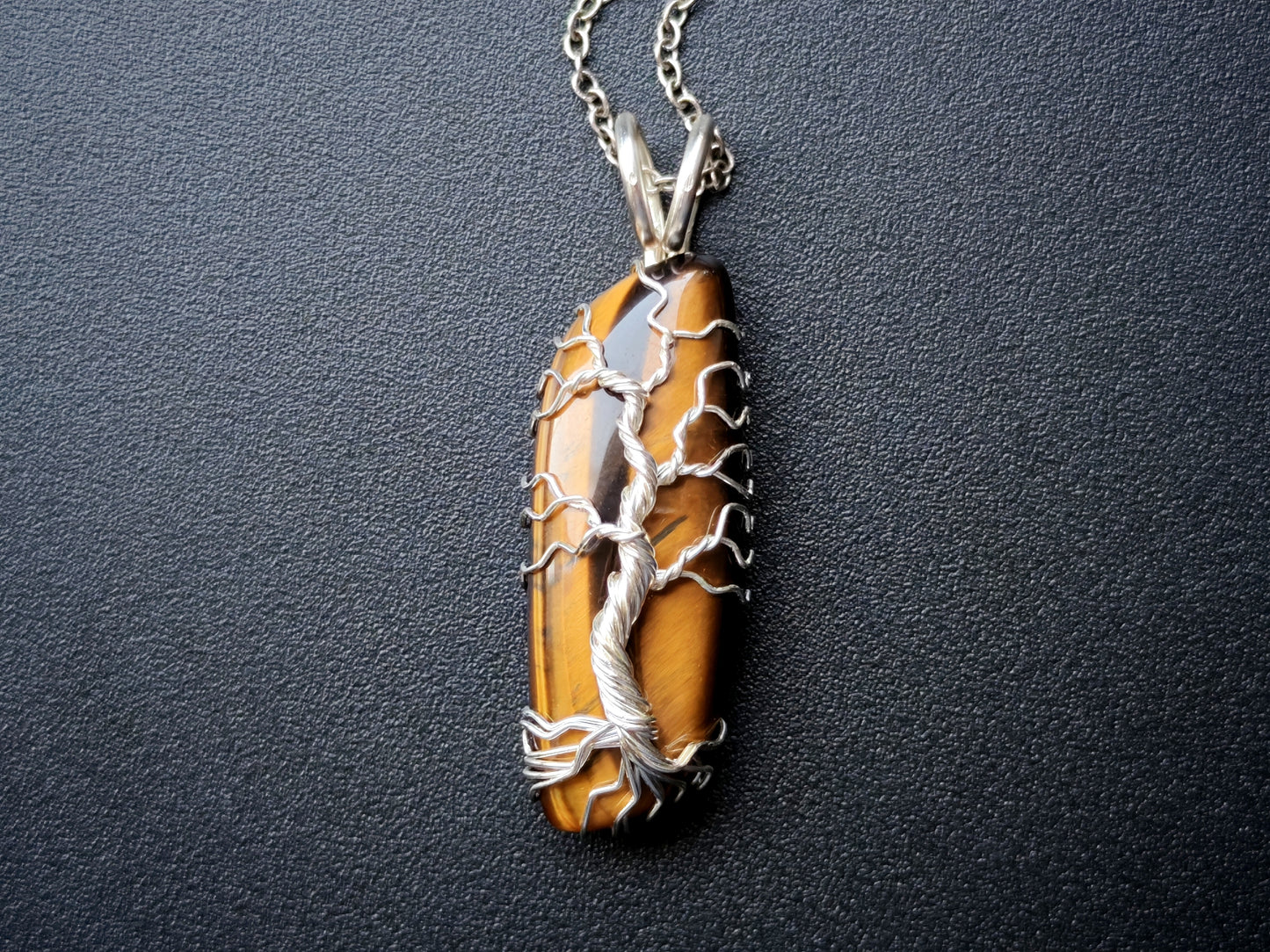 Tree pendant with a tiger's eye gemstone