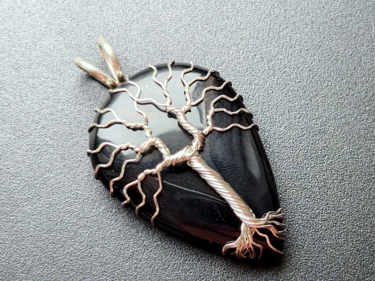 Tree pendant with a black onyx gemstone