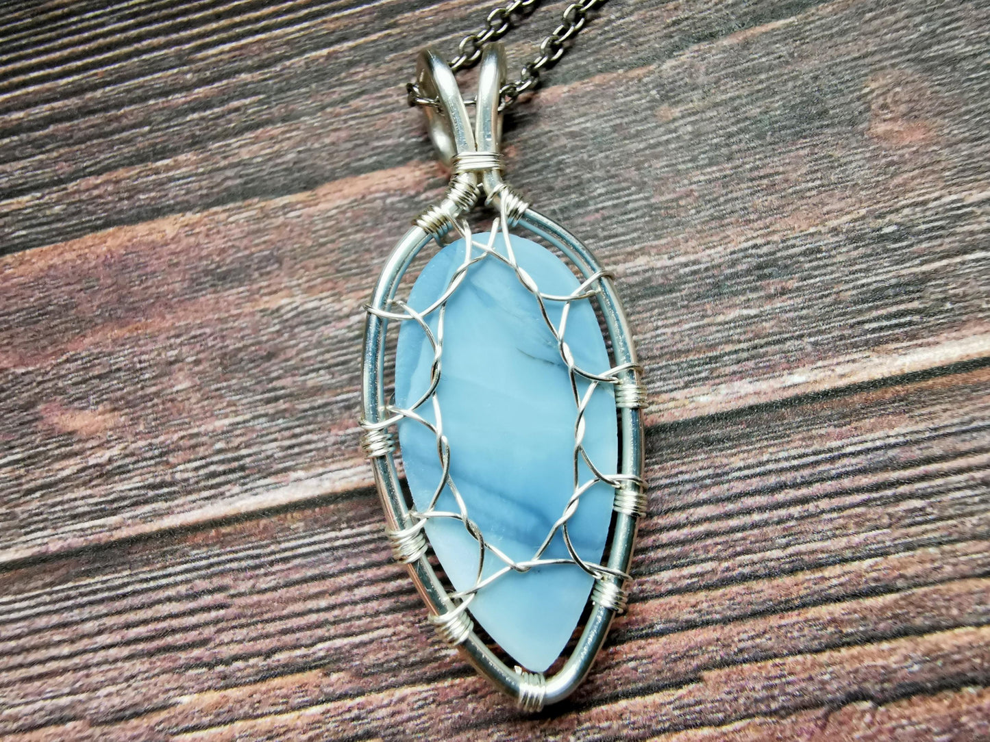 Leaf pendant with a blue opal gemstone