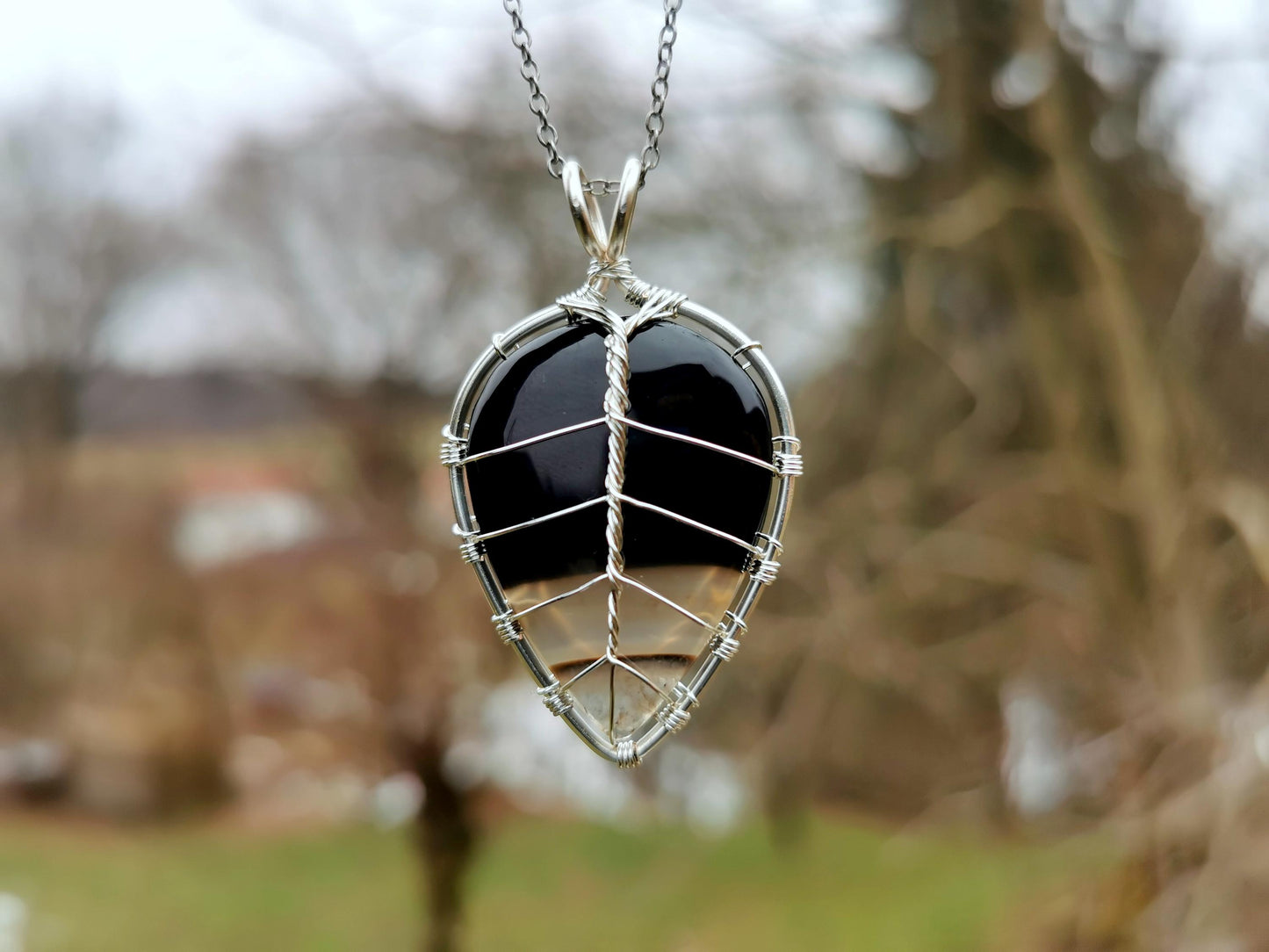 Leaf pendant with a black onyx gemstone