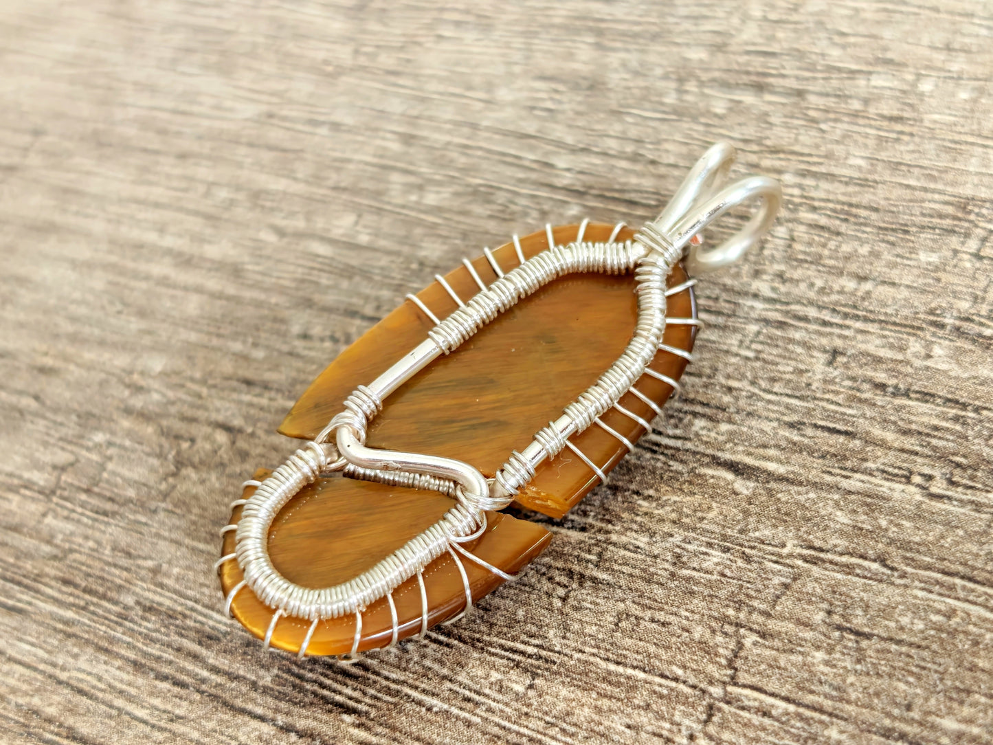 Tree pendant with a broken tiger's eye gemstone
