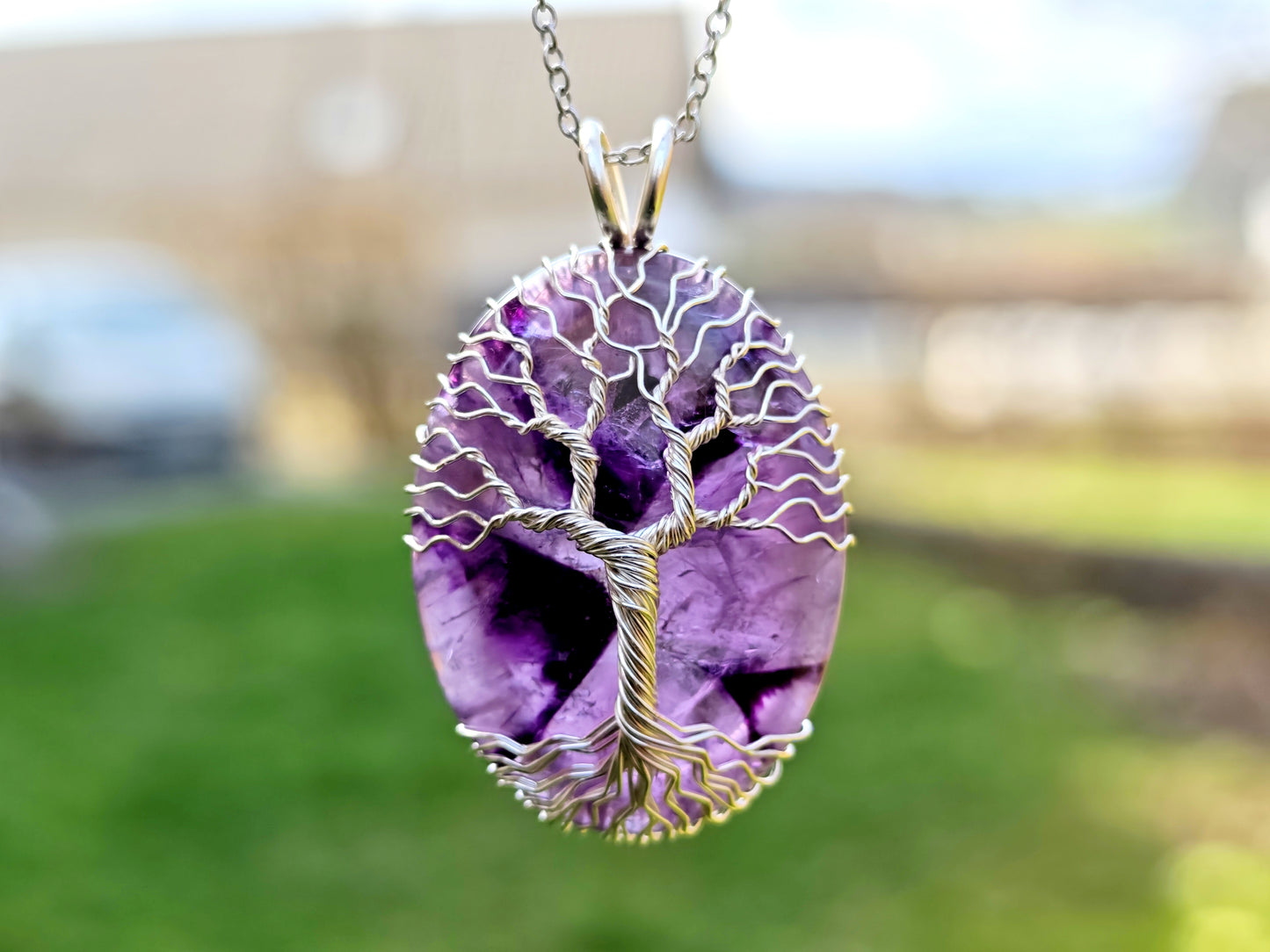 Tree pendant with an amethyst gemstone