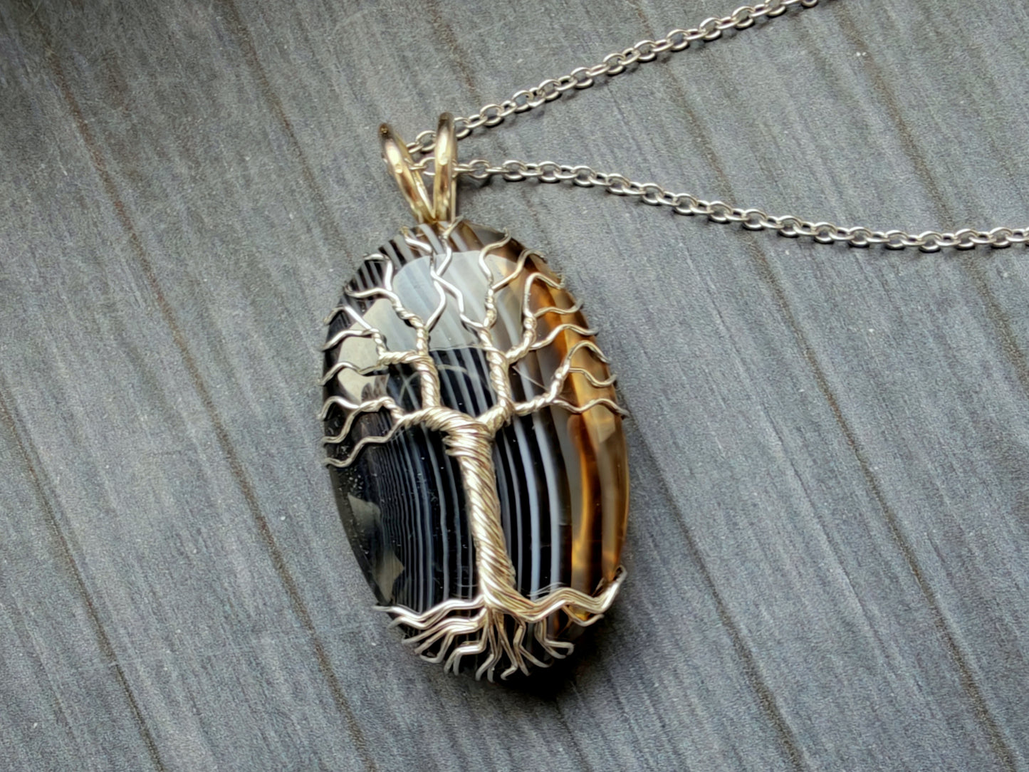 Tree pendant with a black onyx gemstone
