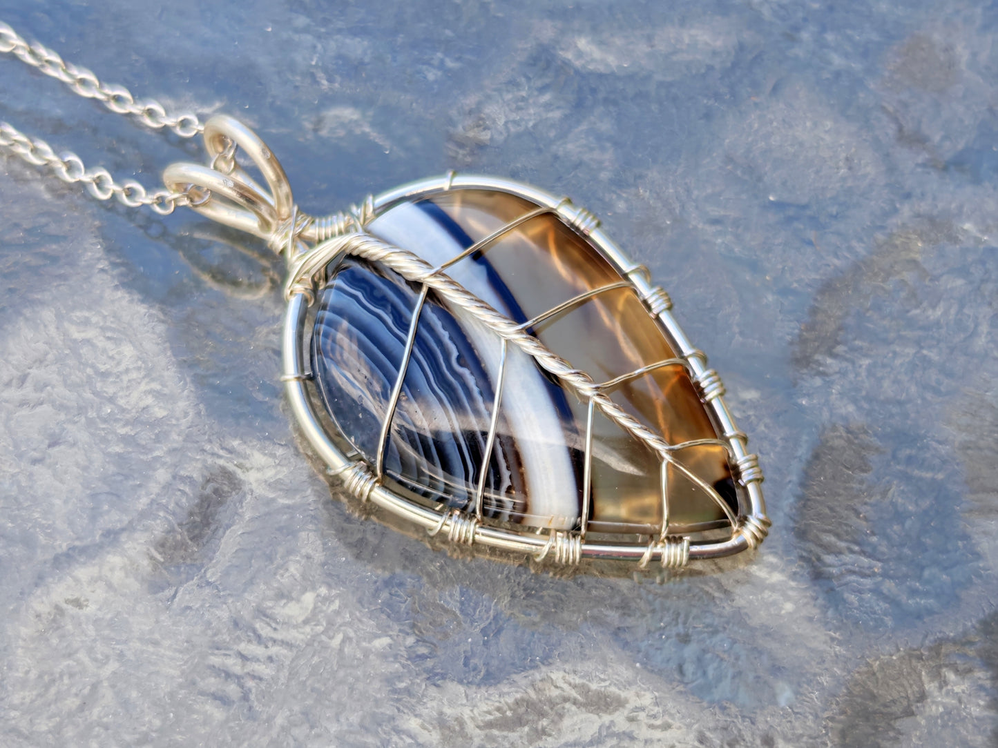 Leaf pendant with a black onyx gemstone