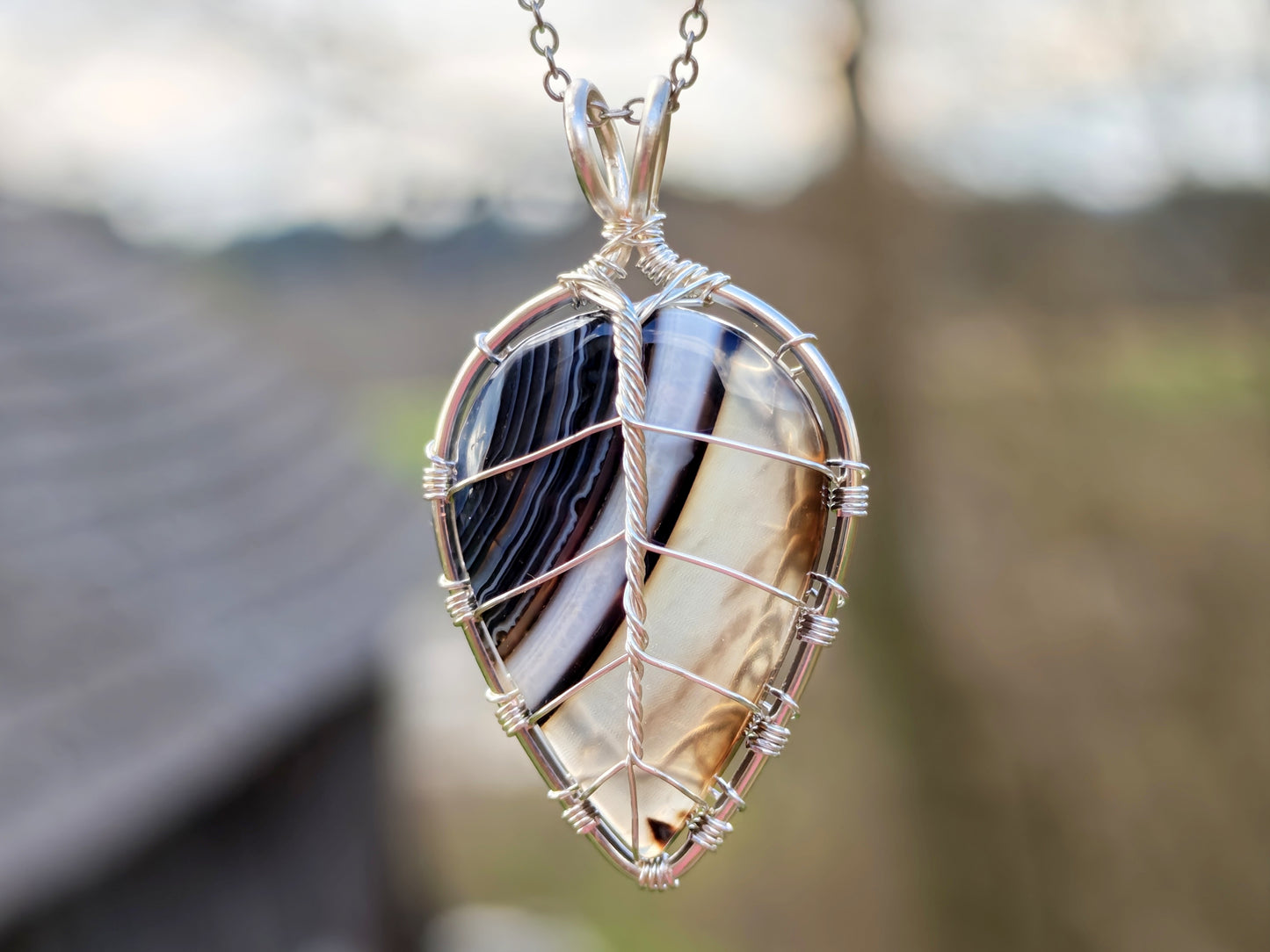 Leaf pendant with a black onyx gemstone