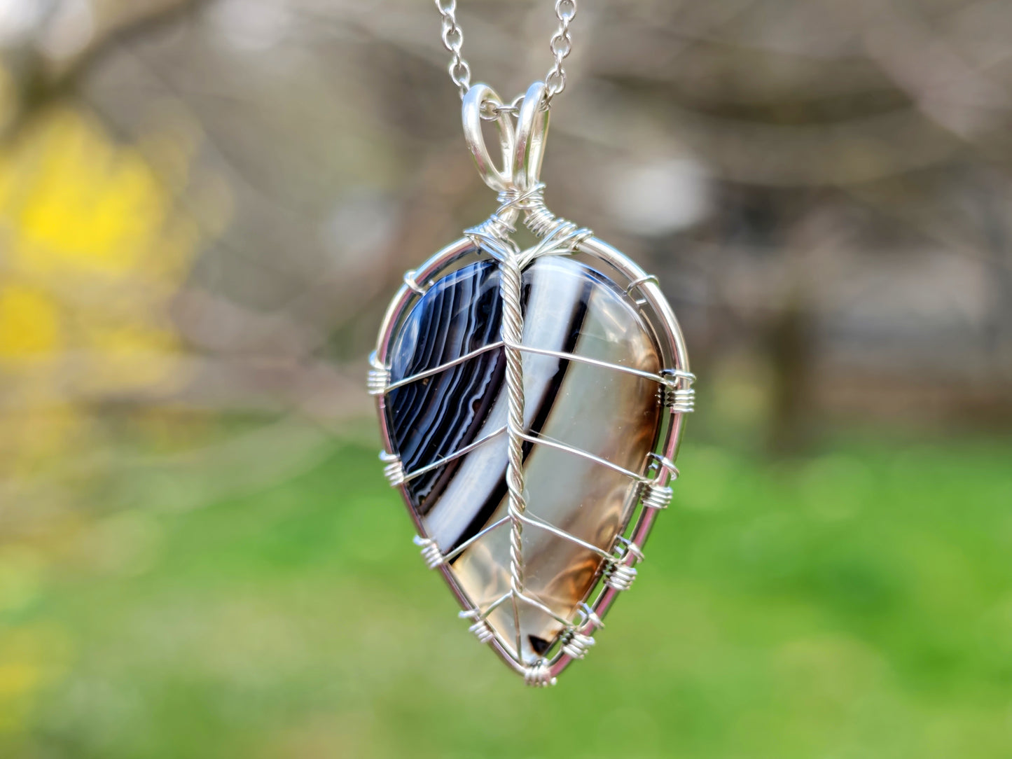 Leaf pendant with a black onyx gemstone