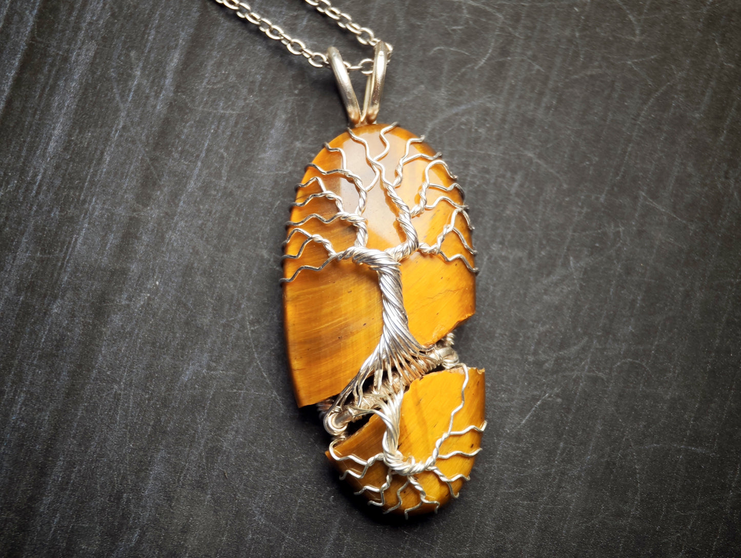 Tree pendant with a broken tiger's eye gemstone