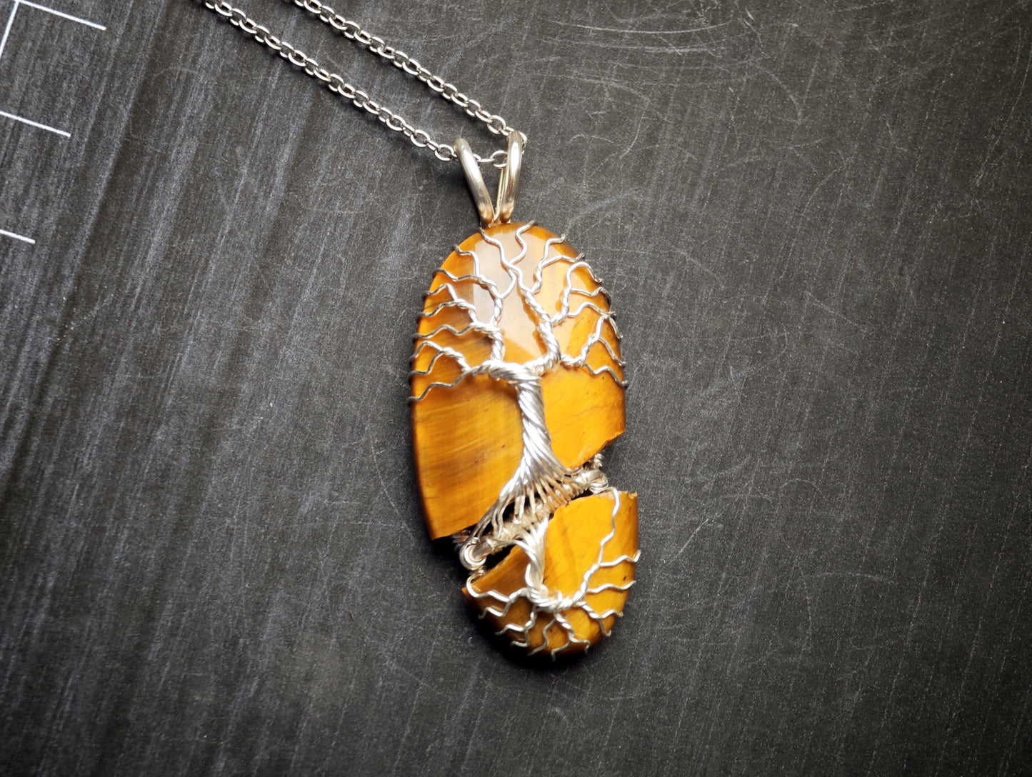 Tree pendant with a broken tiger's eye gemstone