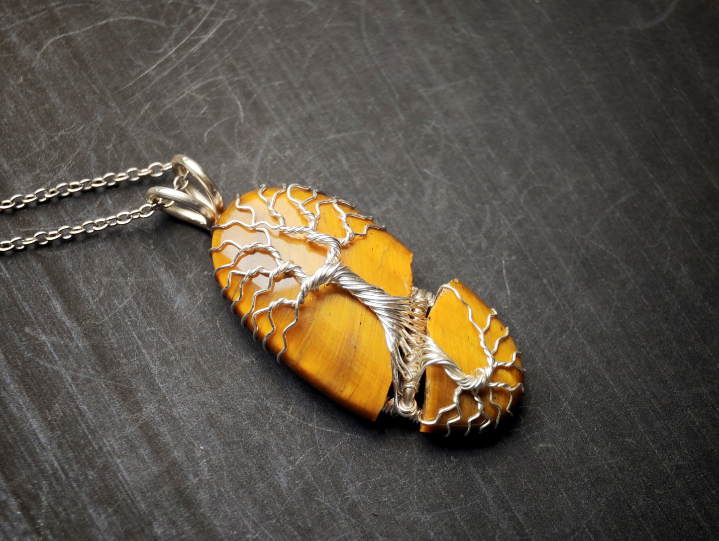 Tree pendant with a broken tiger's eye gemstone