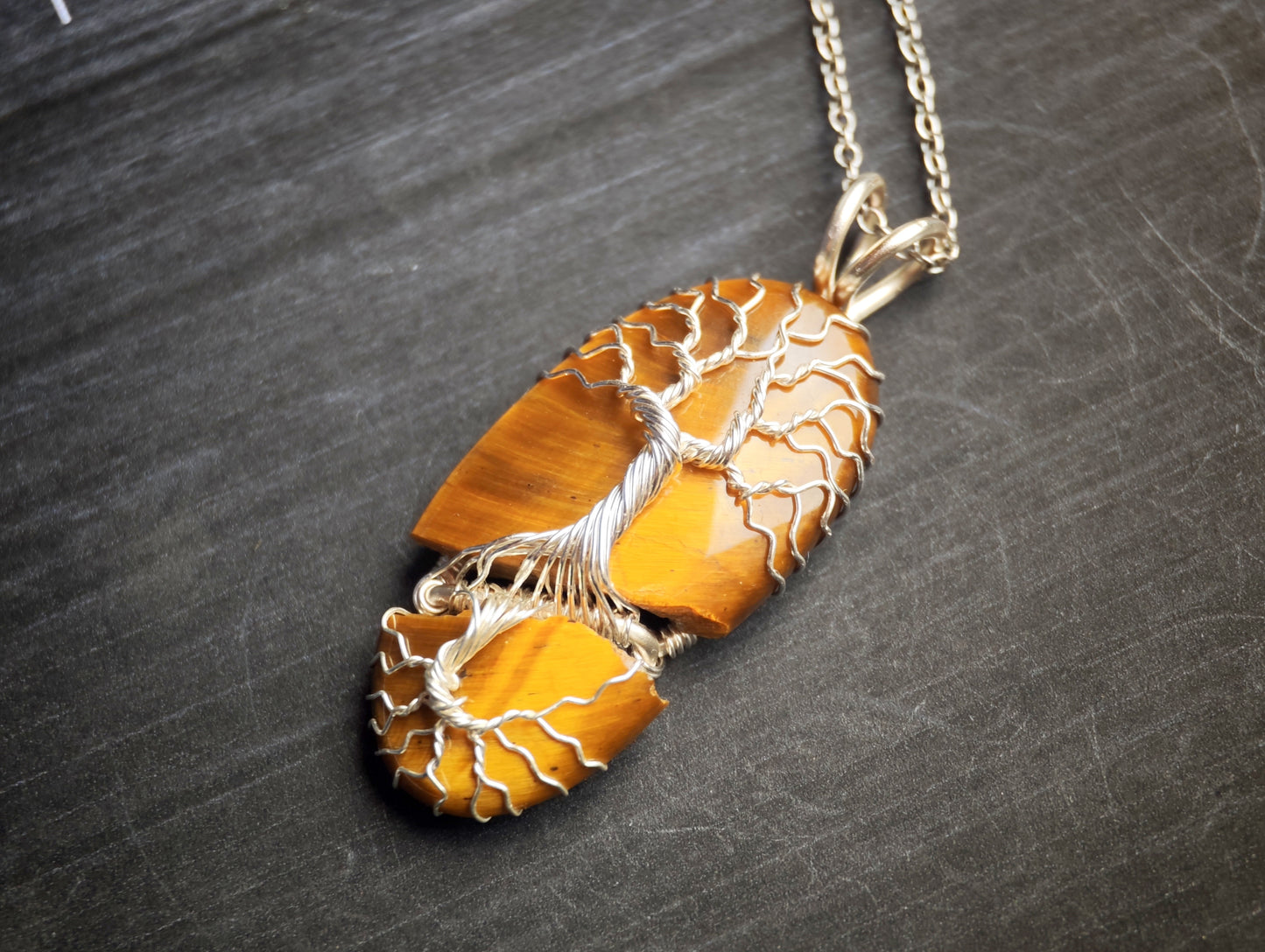 Tree pendant with a broken tiger's eye gemstone