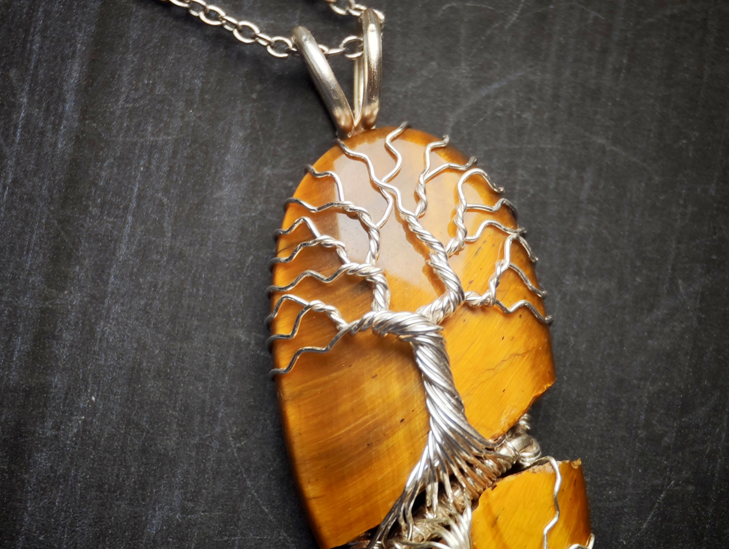 Tree pendant with a broken tiger's eye gemstone