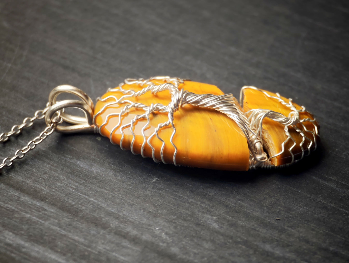 Tree pendant with a broken tiger's eye gemstone