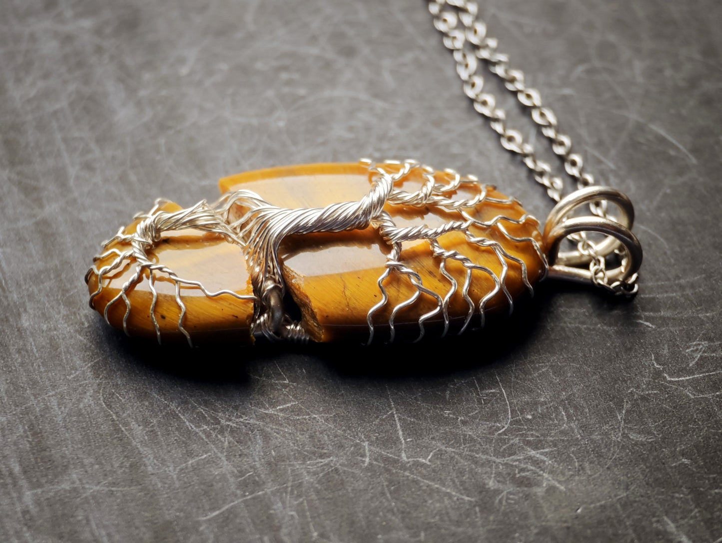 Tree pendant with a broken tiger's eye gemstone