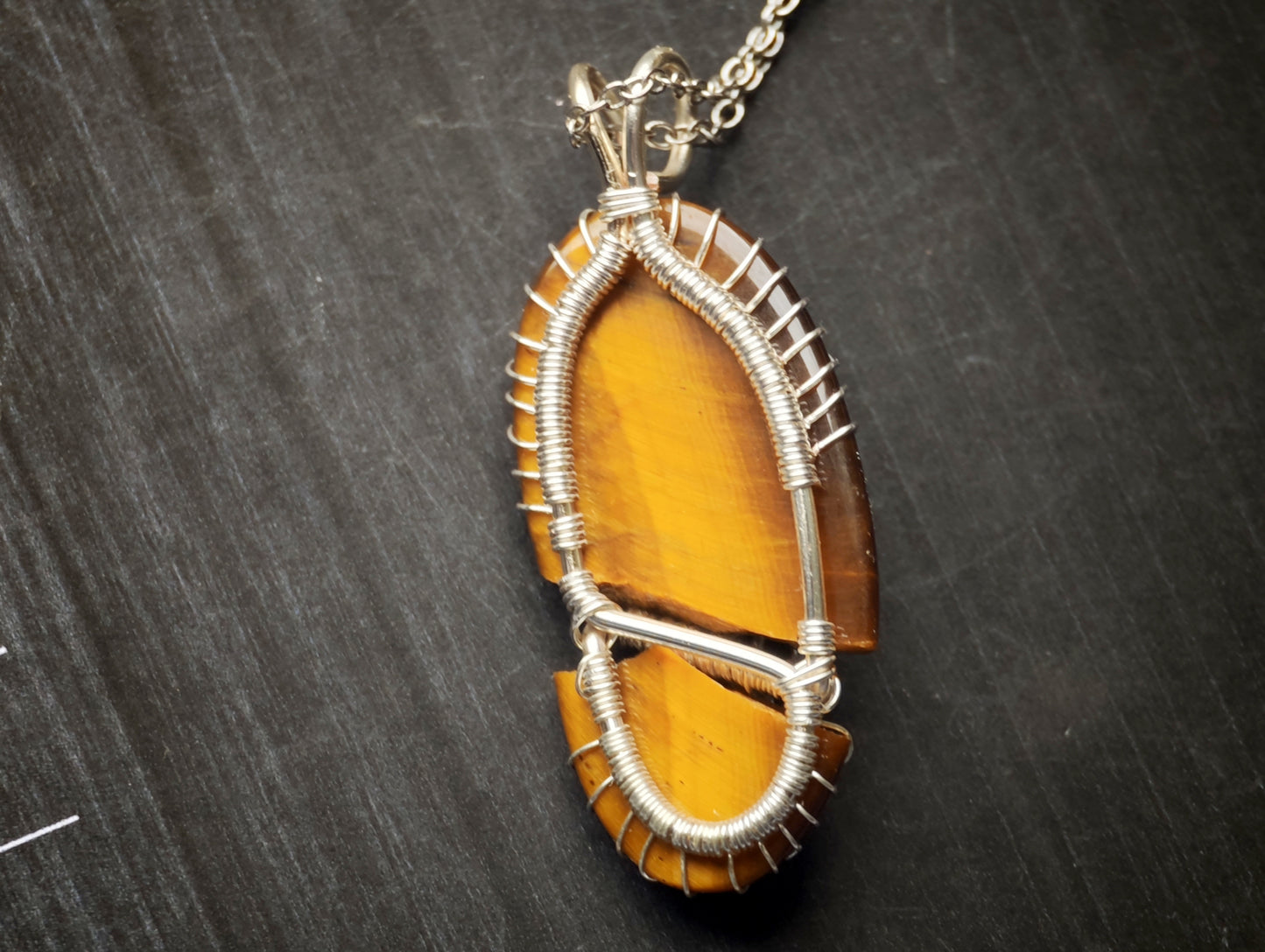 Tree pendant with a broken tiger's eye gemstone