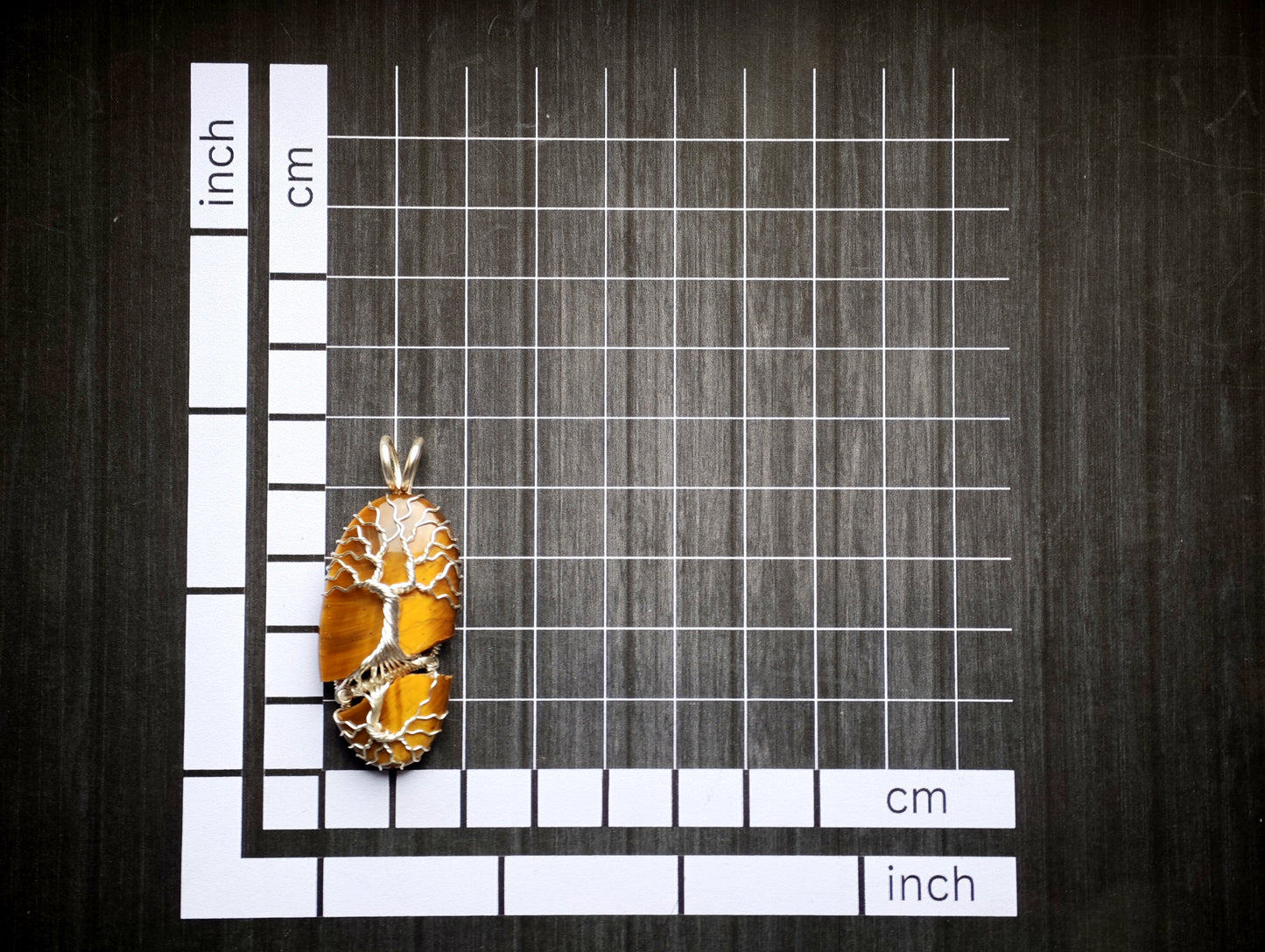 Tree pendant with a broken tiger's eye gemstone