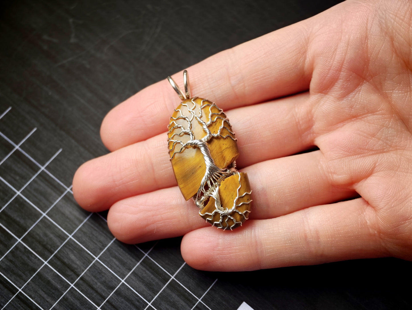 Tree pendant with a broken tiger's eye gemstone