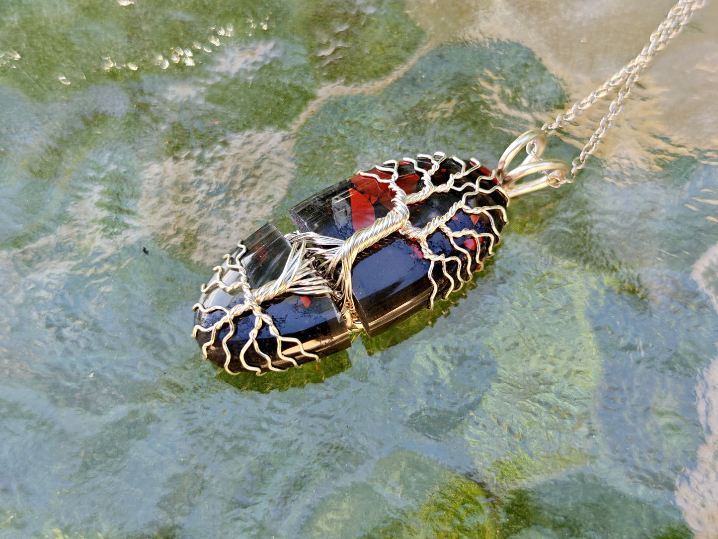 Tree pendant with a broken bloodstone gemstone