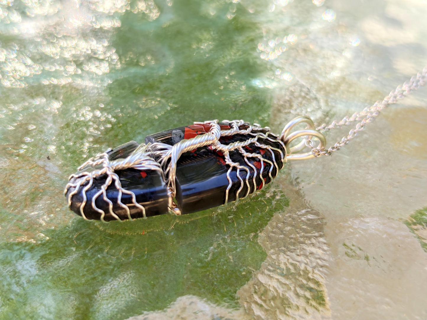 Tree pendant with a broken bloodstone gemstone