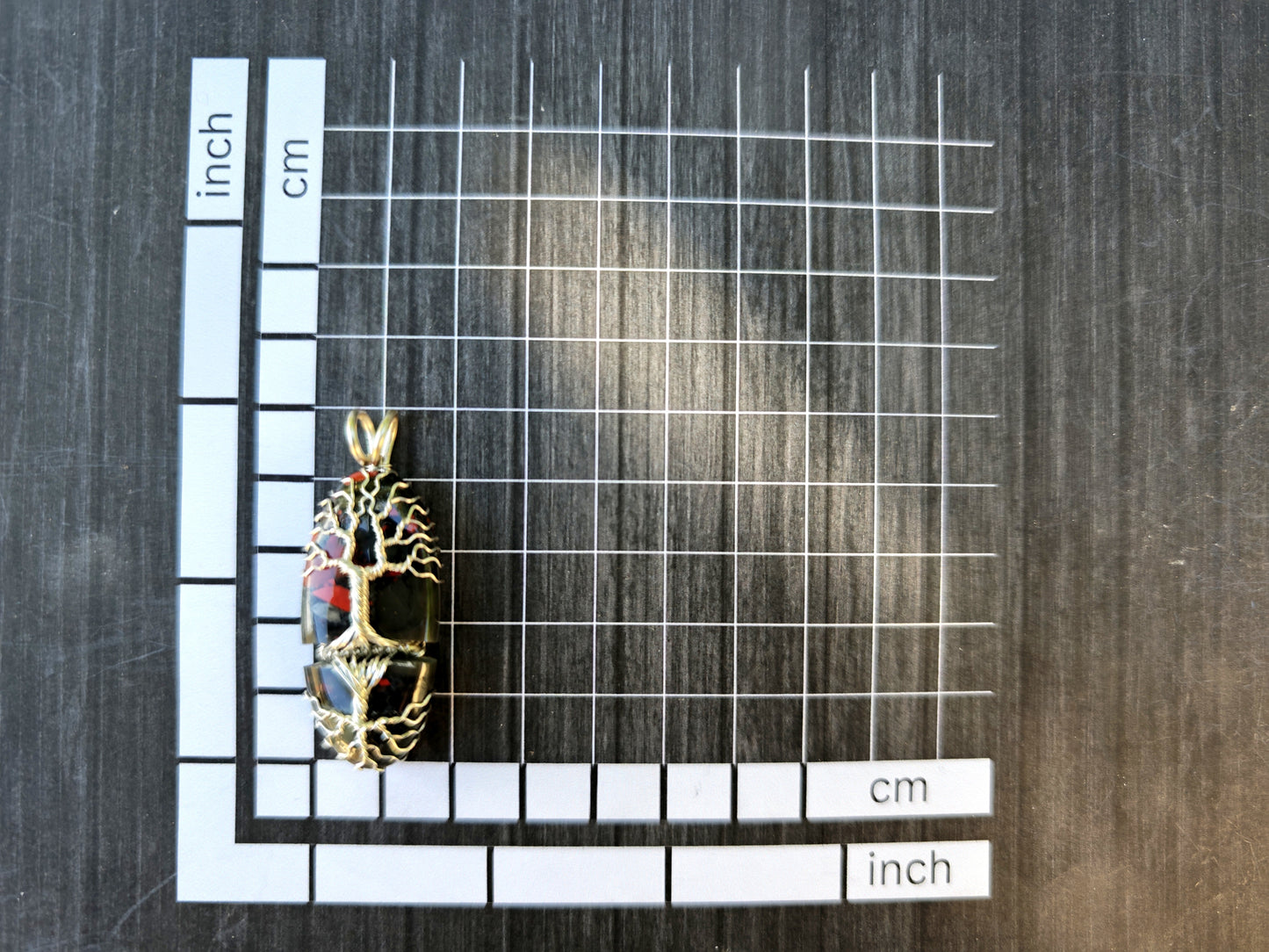 Tree pendant with a broken bloodstone gemstone