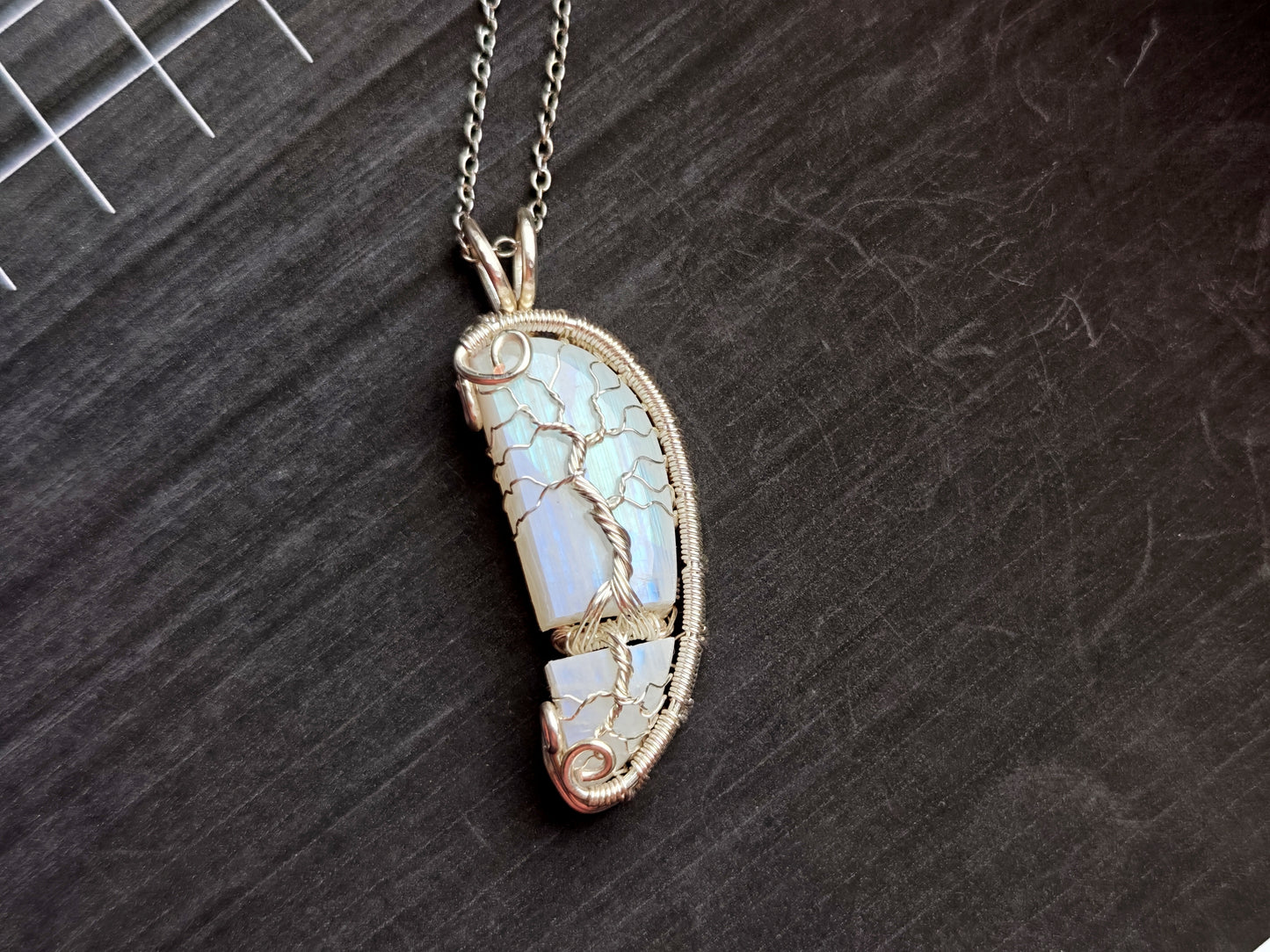 Tree pendant with a broken moonstone