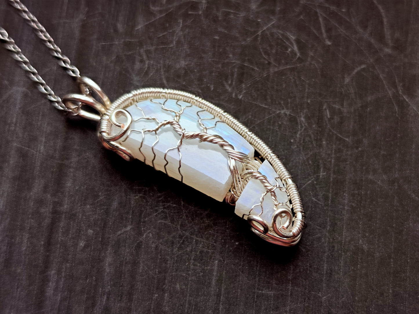 Tree pendant with a broken moonstone