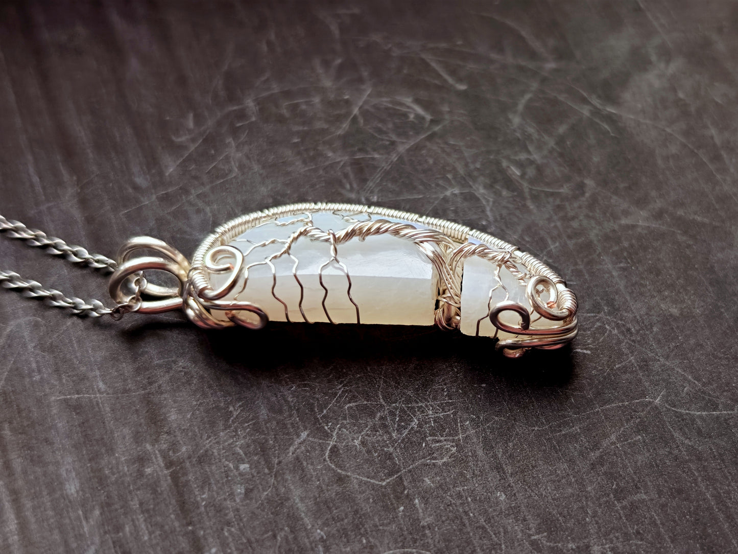 Tree pendant with a broken moonstone