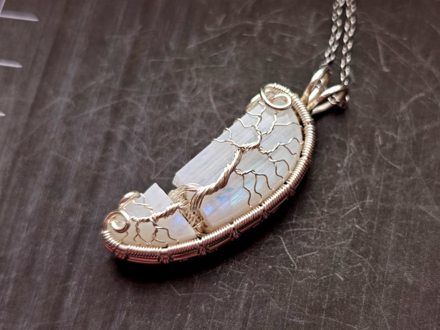 Tree pendant with a broken moonstone