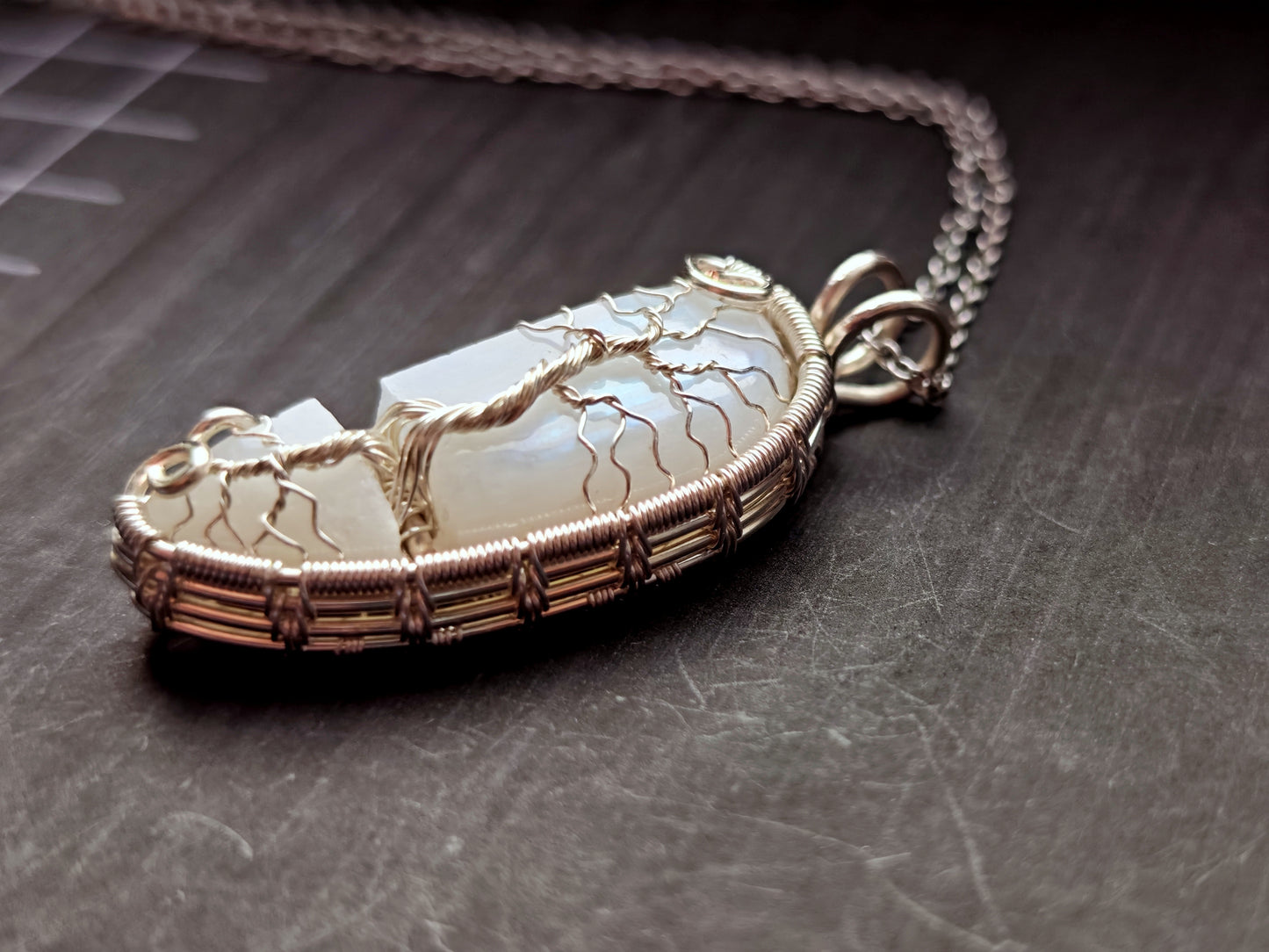 Tree pendant with a broken moonstone
