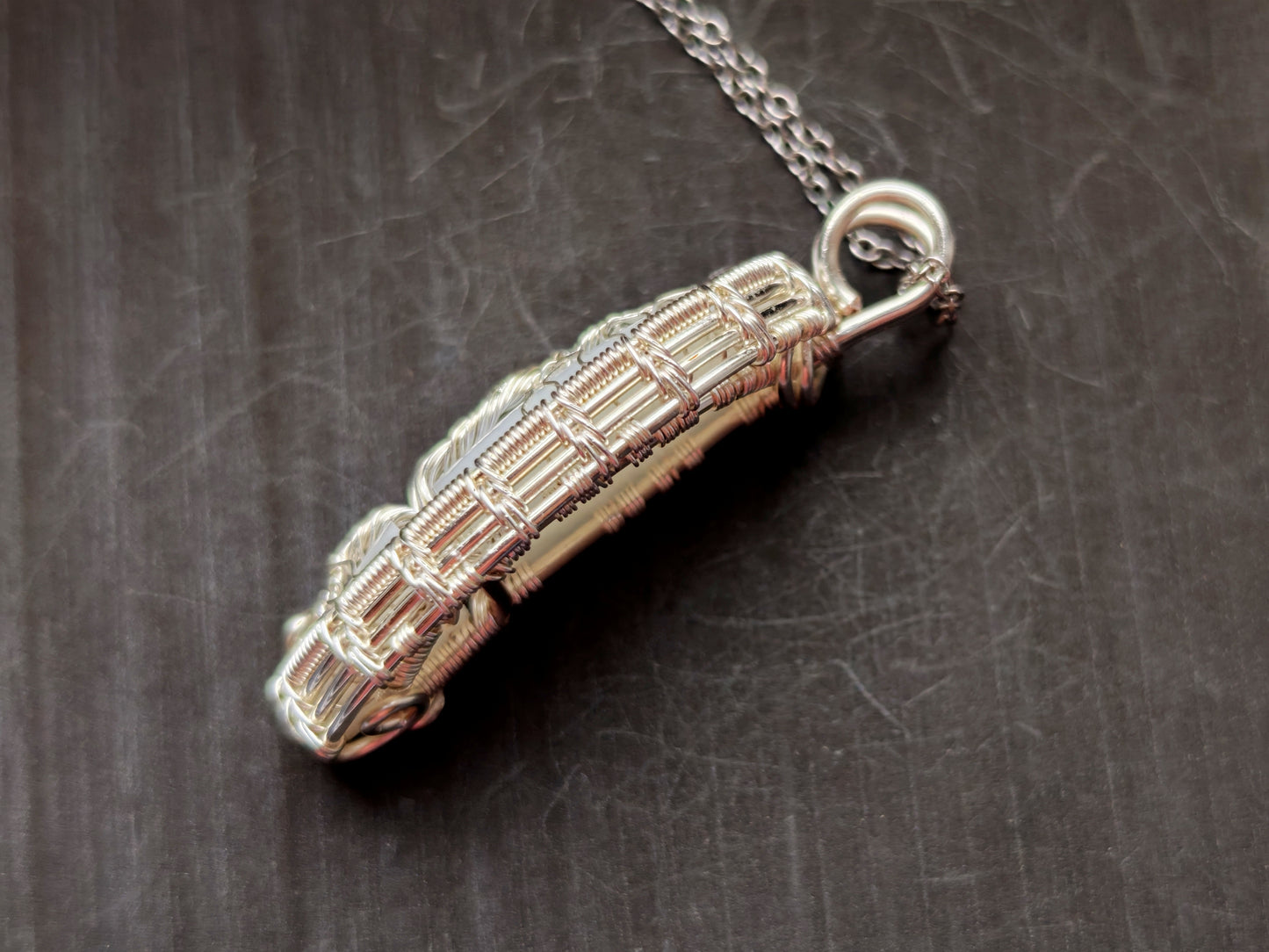 Tree pendant with a broken moonstone