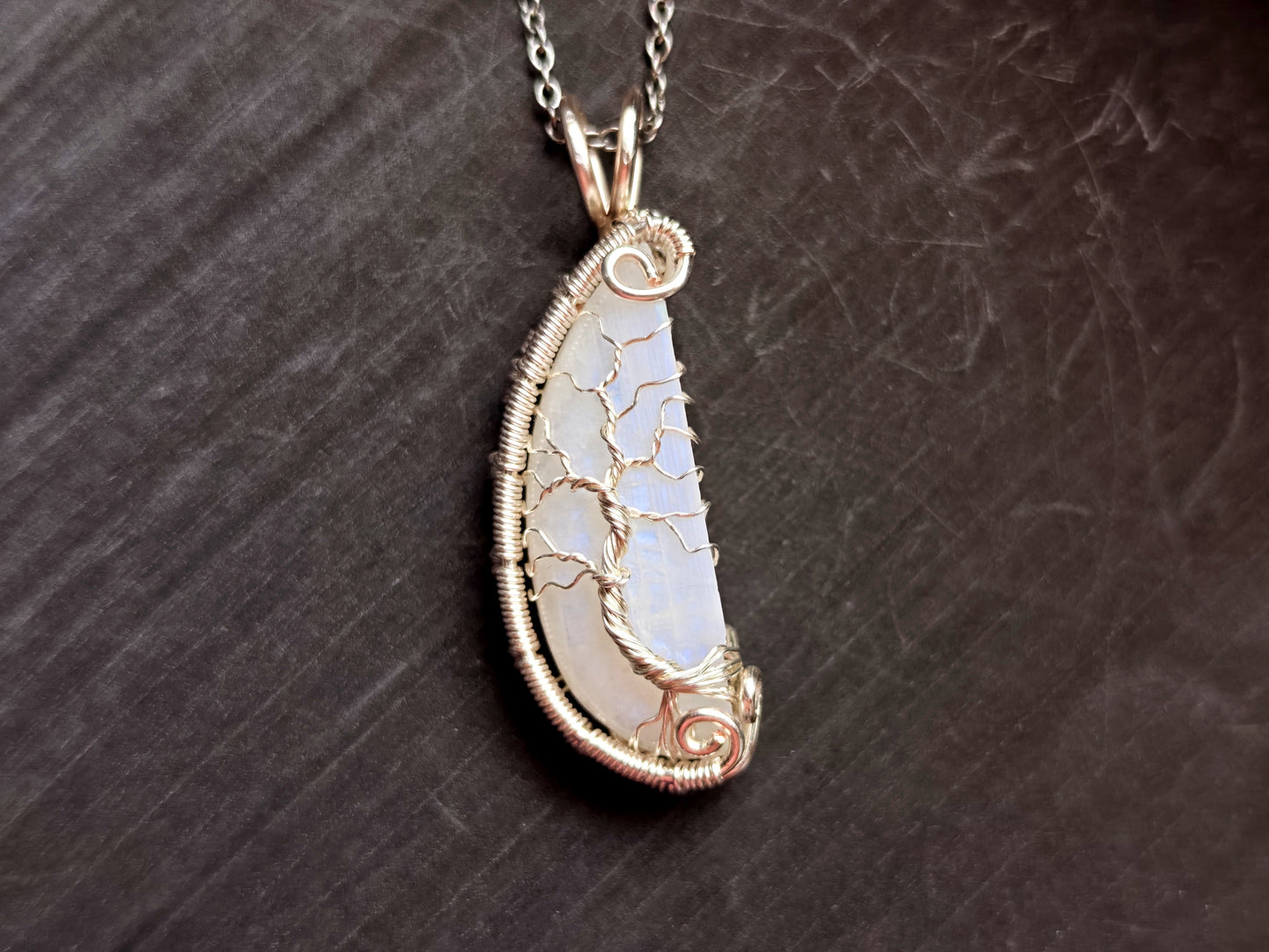 Tree pendant with a broken moonstone