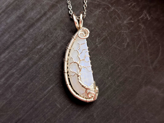 Tree pendant with a broken moonstone