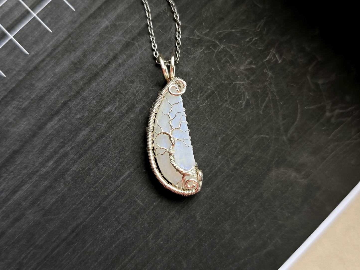 Tree pendant with a broken moonstone