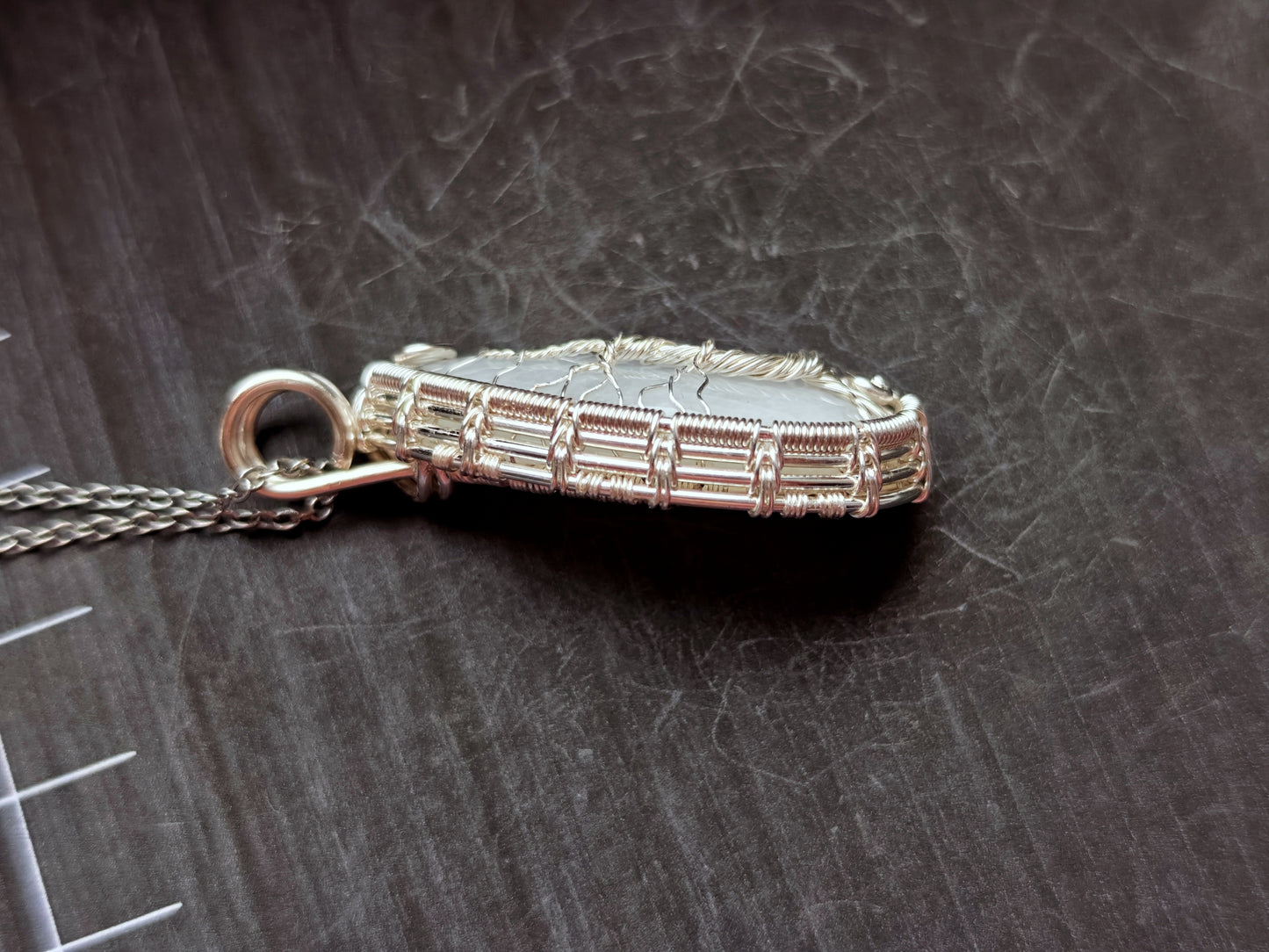 Tree pendant with a broken moonstone