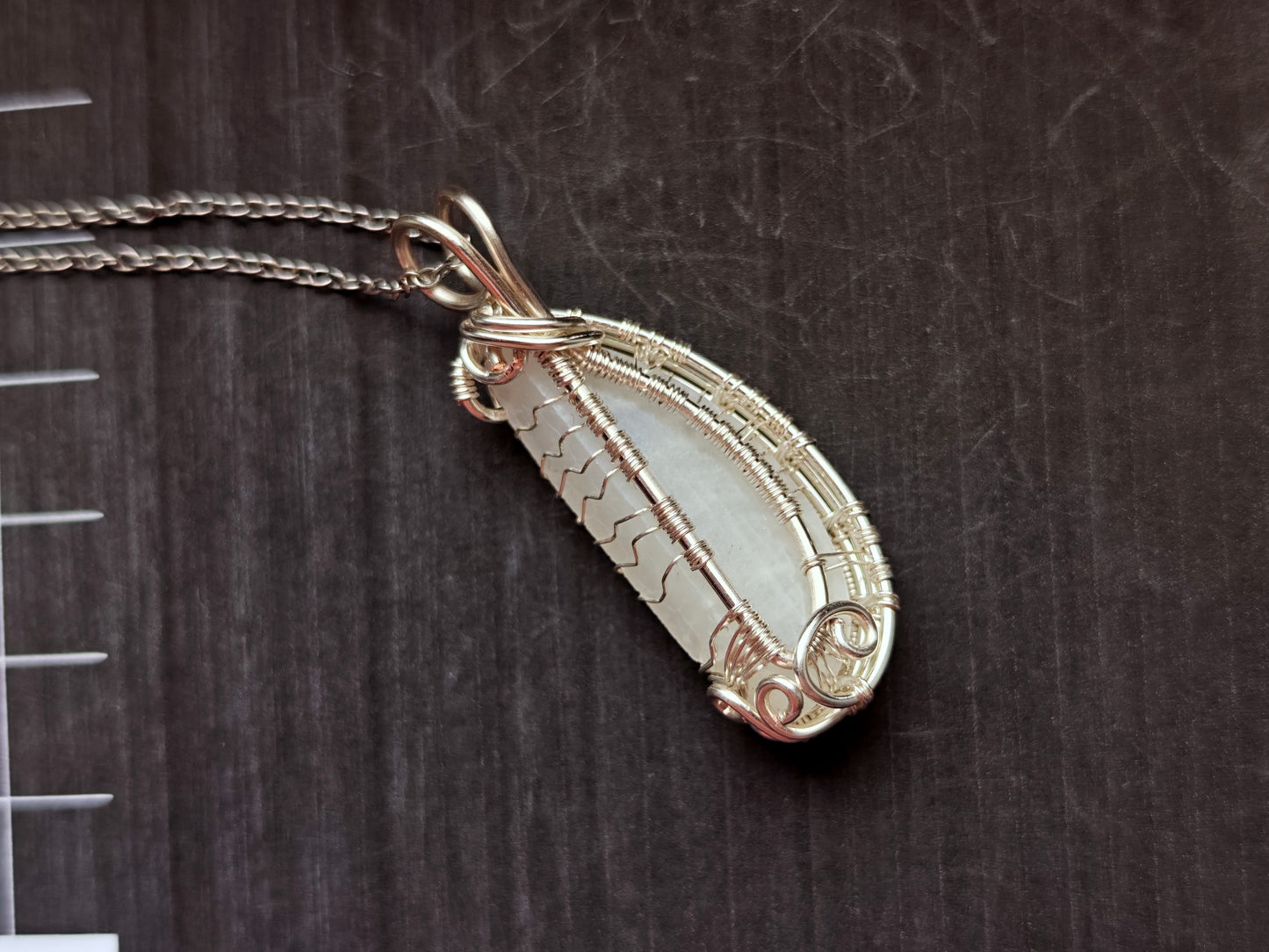 Tree pendant with a broken moonstone