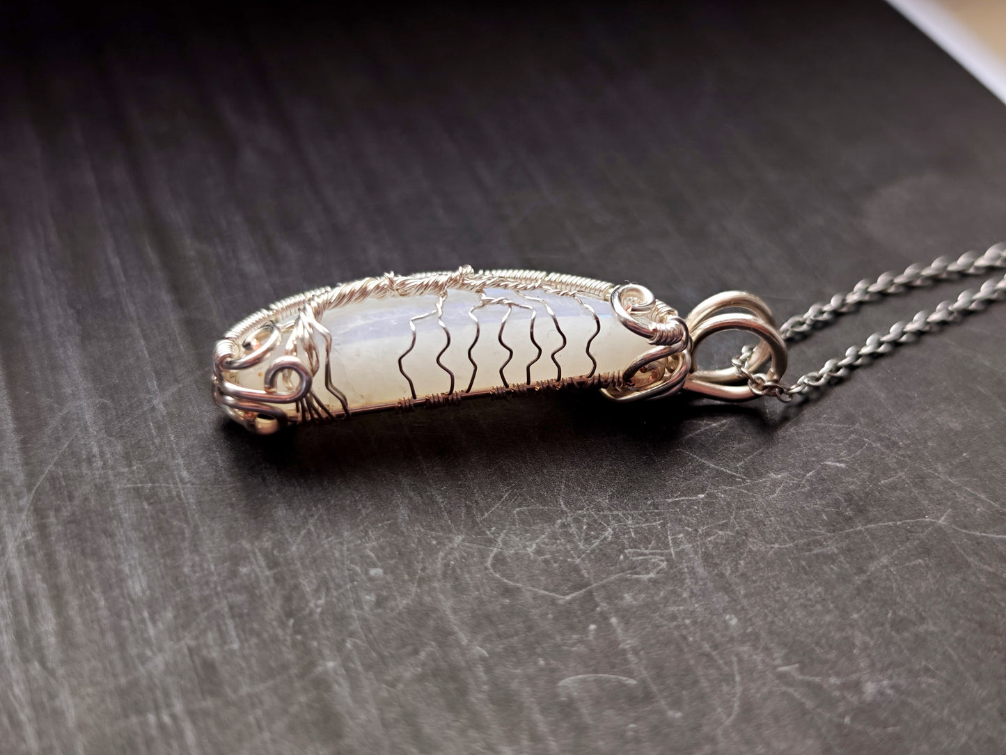 Tree pendant with a broken moonstone