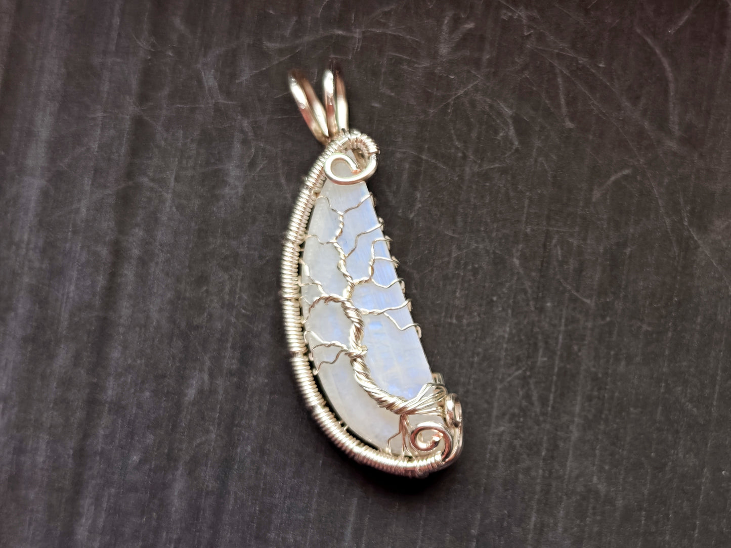 Tree pendant with a broken moonstone