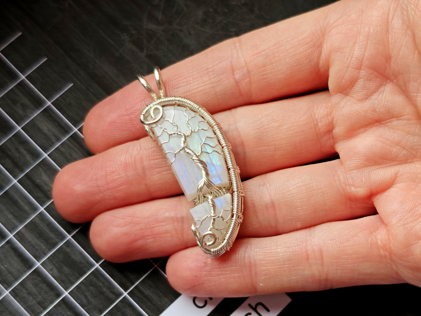 Tree pendant with a broken moonstone