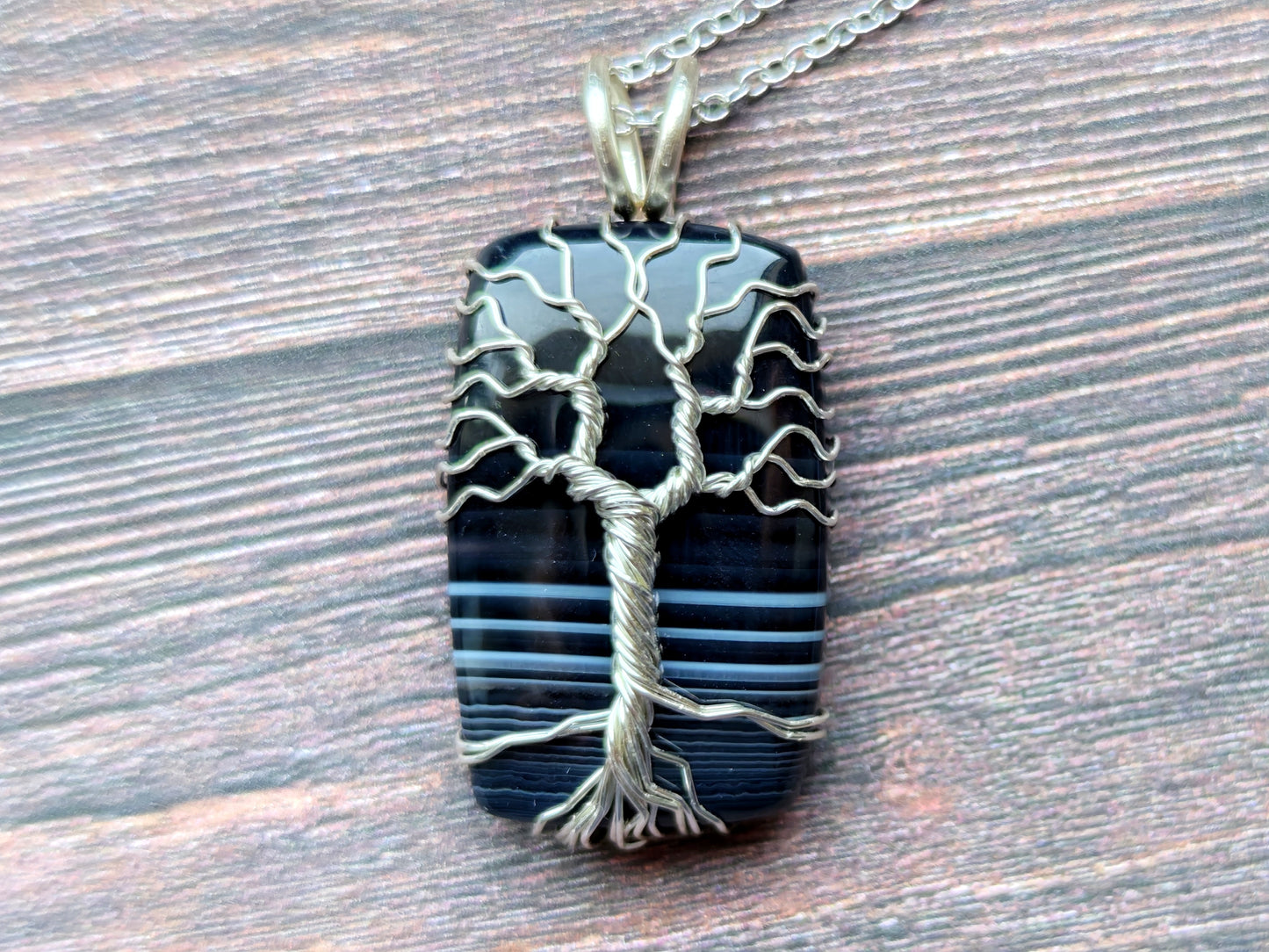 Tree pendant with a black onyx gemstone