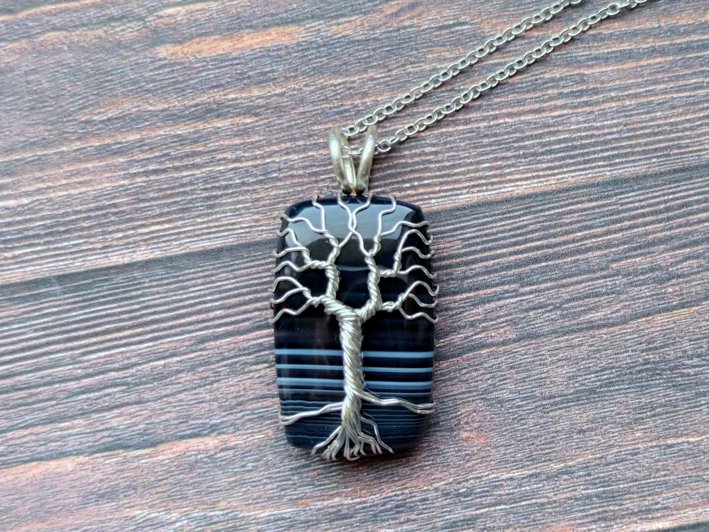 Tree pendant with a black onyx gemstone