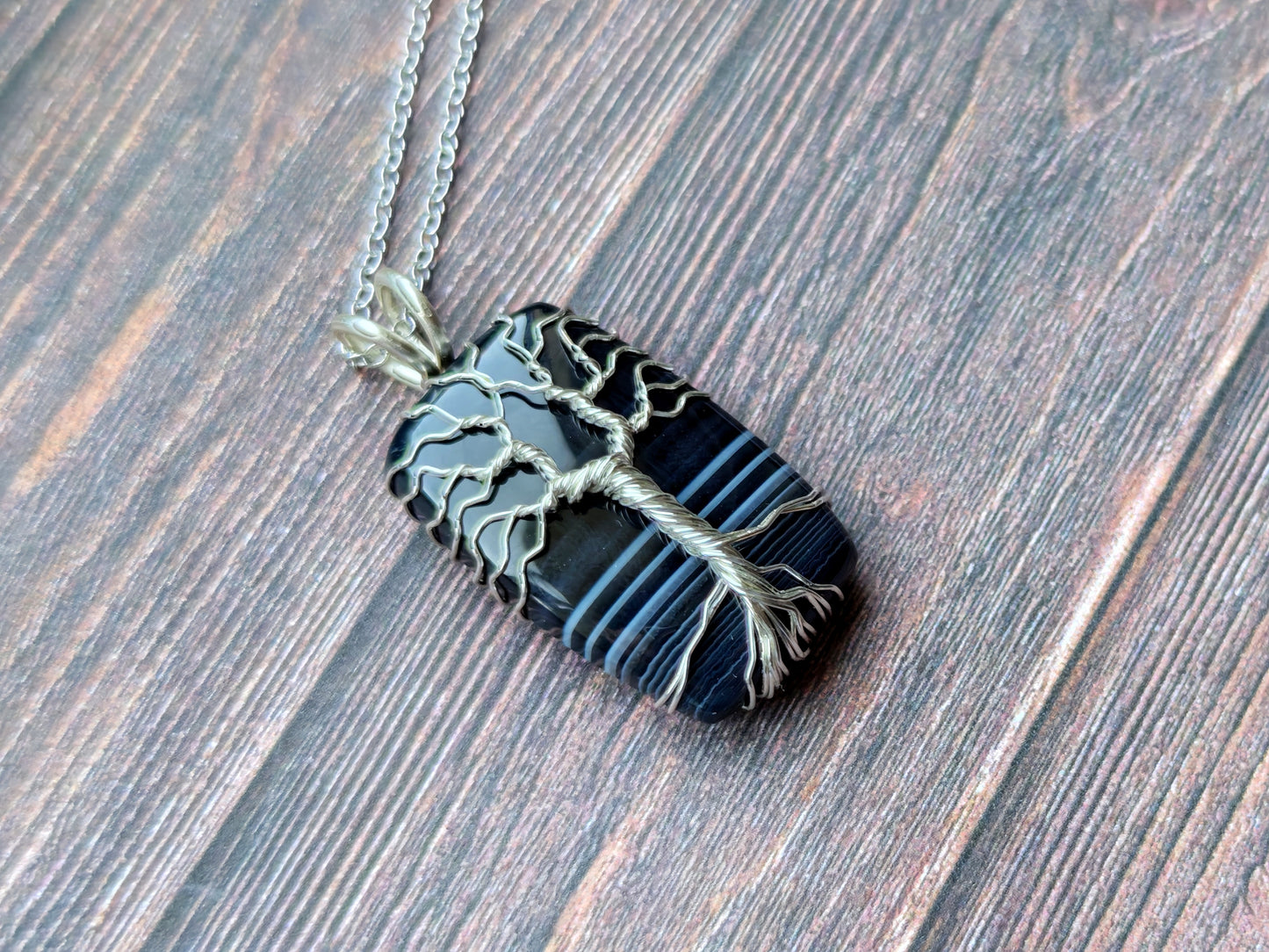 Tree pendant with a black onyx gemstone