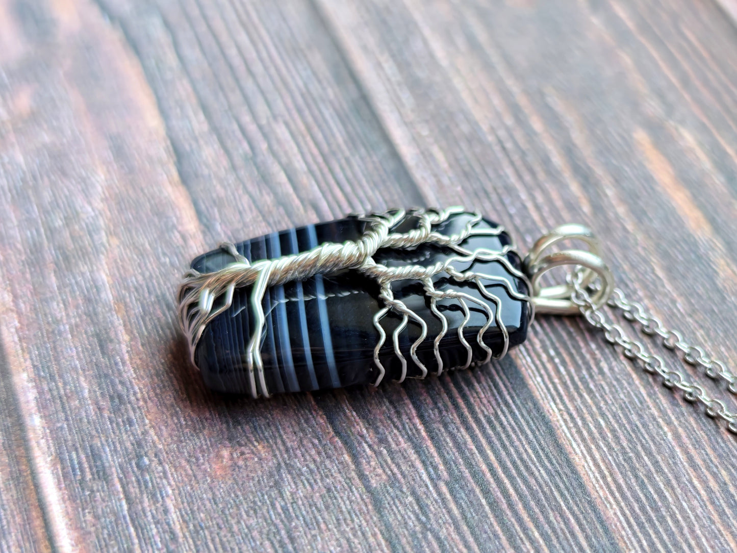 Tree pendant with a black onyx gemstone