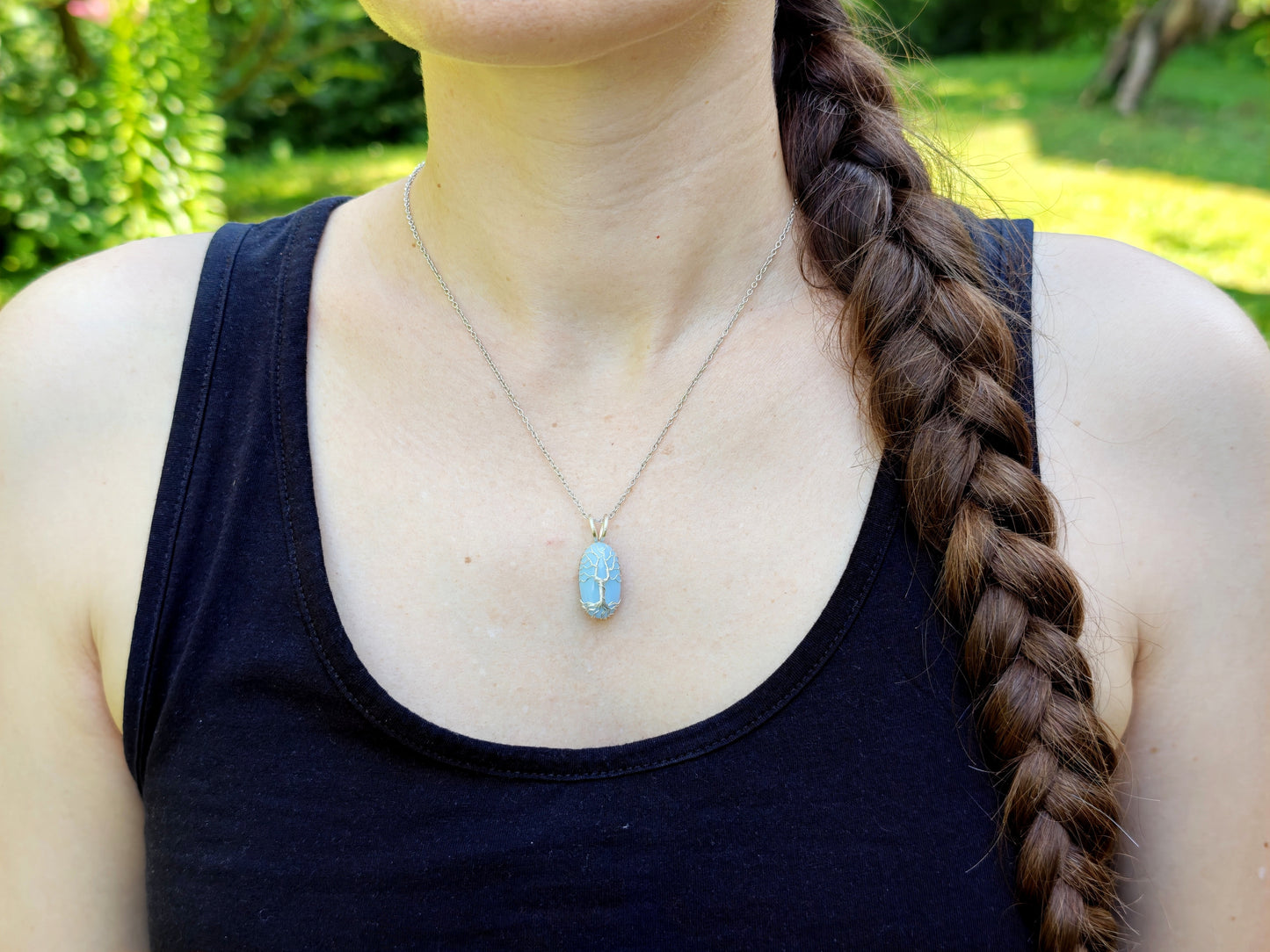 Tree pendant with a blue opal gemstone