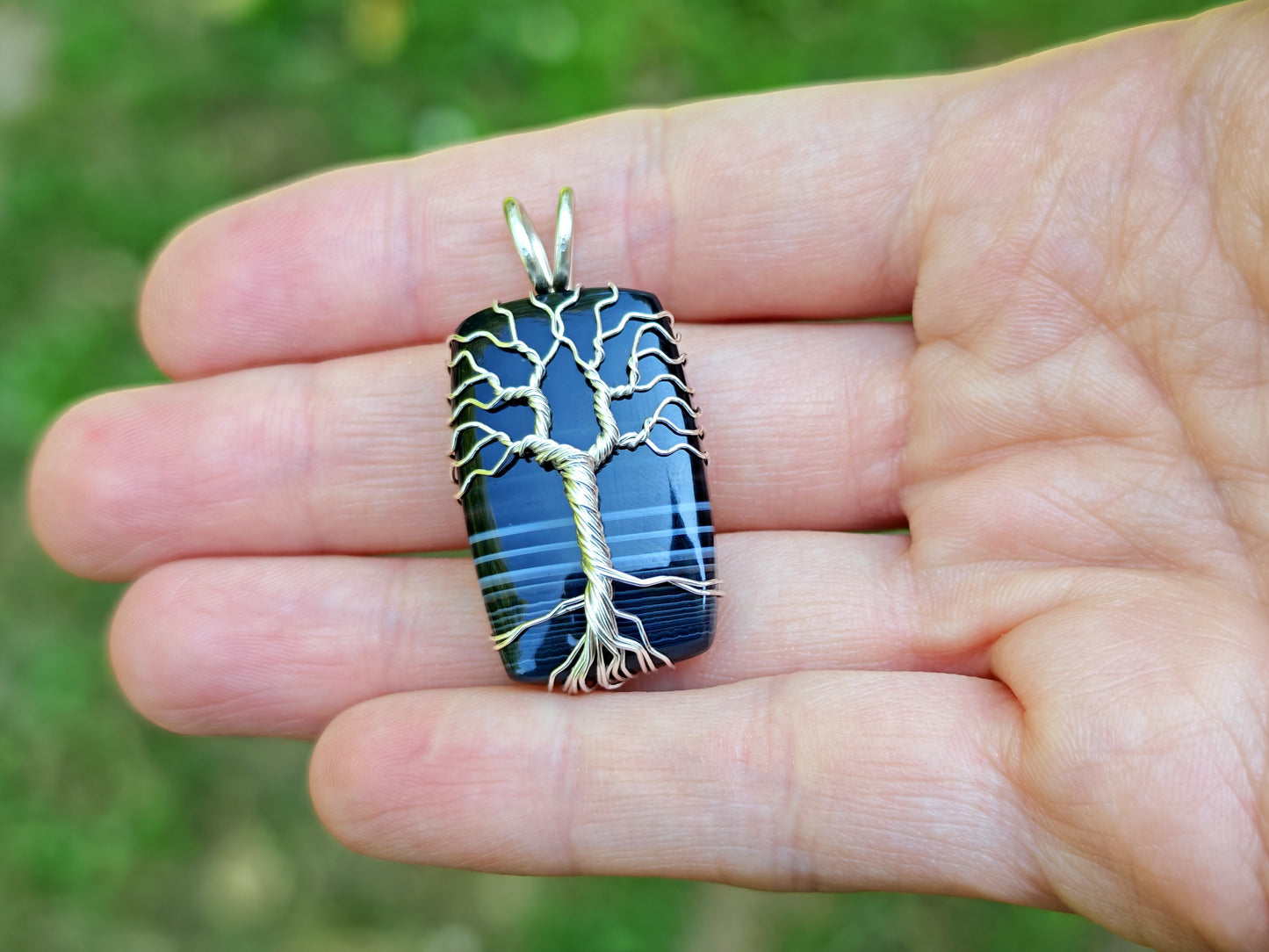 Tree pendant with a black onyx gemstone