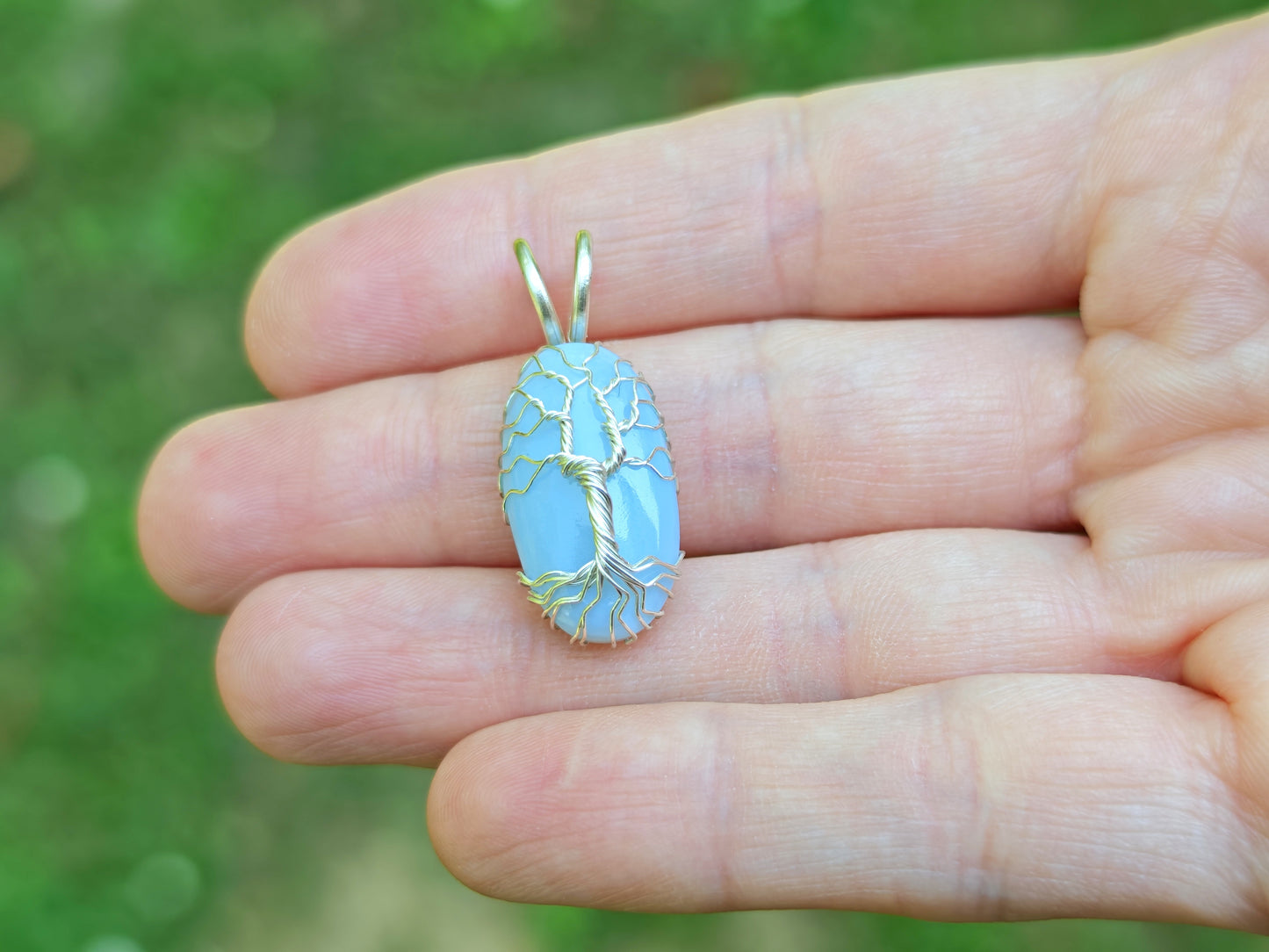 Tree pendant with a blue opal gemstone