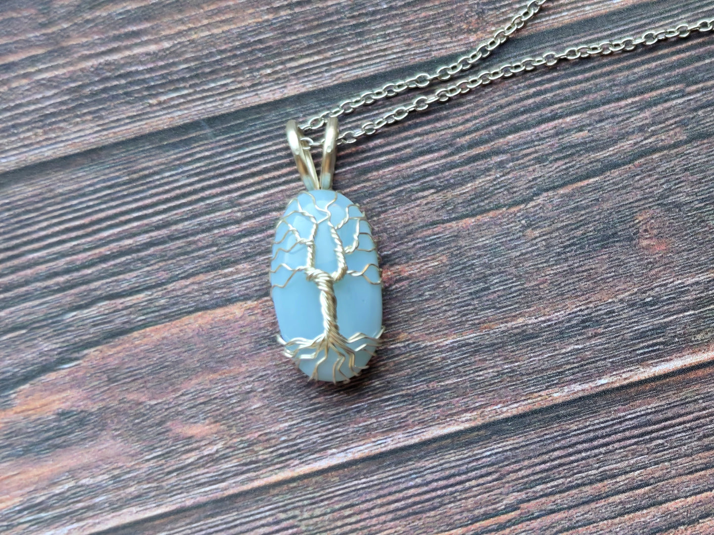 Tree pendant with a blue opal gemstone