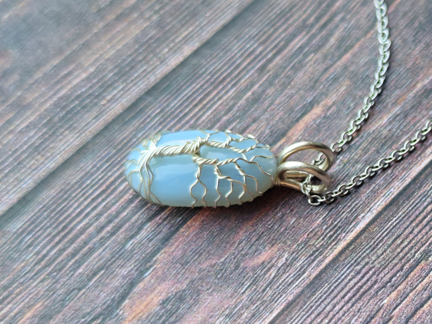 Tree pendant with a blue opal gemstone