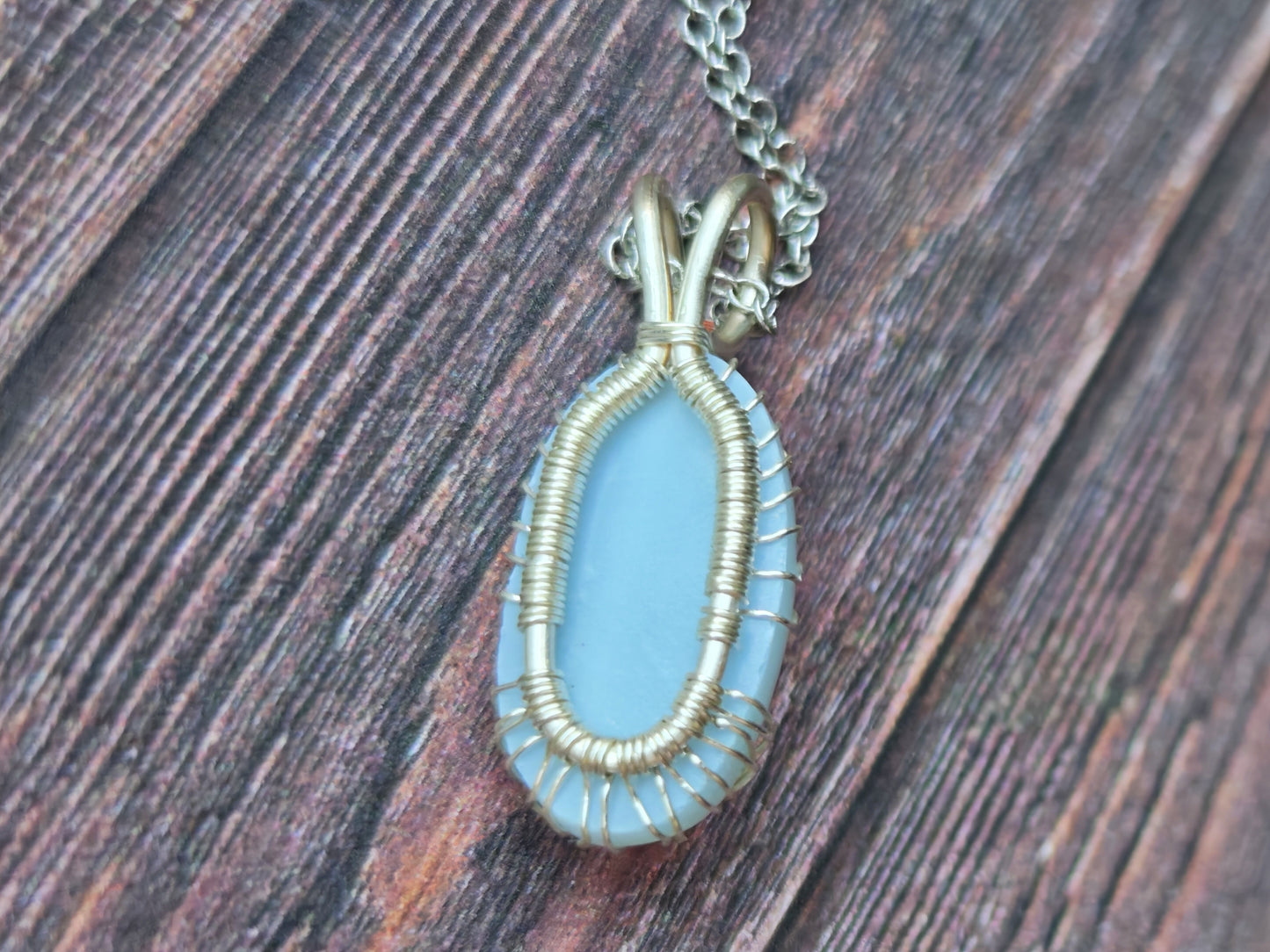 Tree pendant with a blue opal gemstone