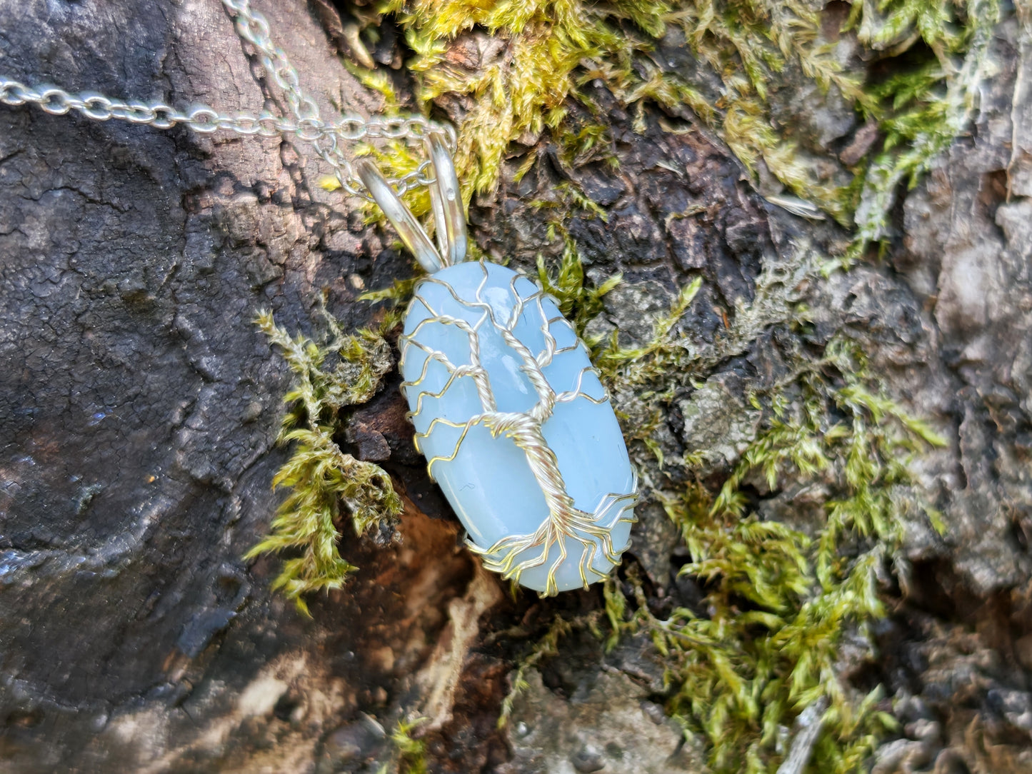 Tree pendant with a blue opal gemstone